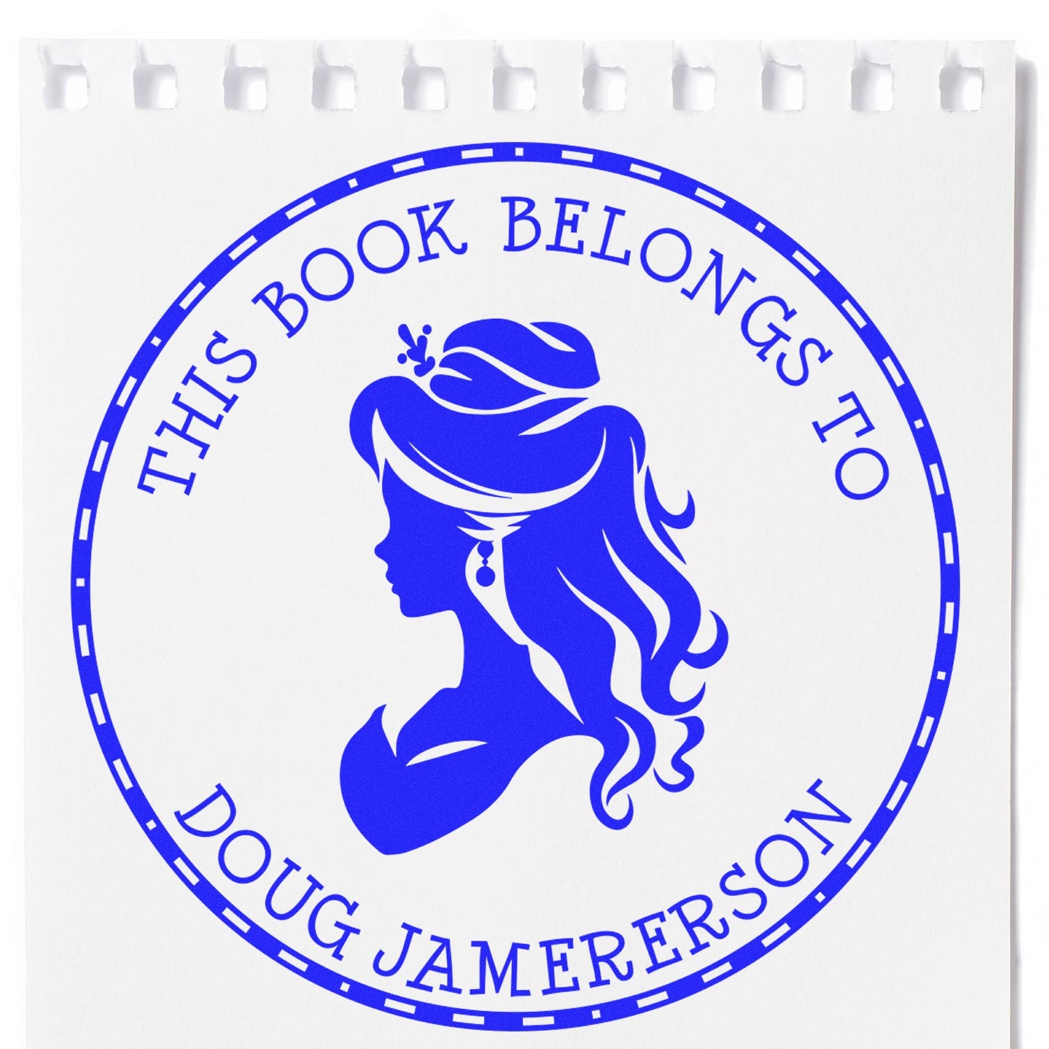 Blue circular self-inking bookplate stamp seal with woman silhouette and This Book Belongs to Doug Jamerson text on white.