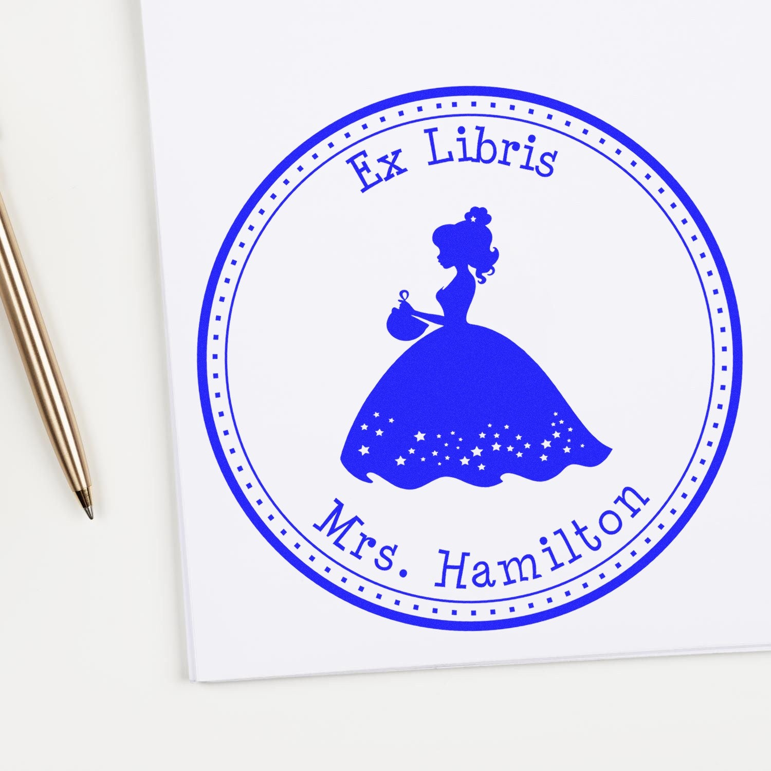 Blue Ex Libris stamp and seal with silhouette of a woman in gown, Mrs. Hamilton text, and dotted circular border.