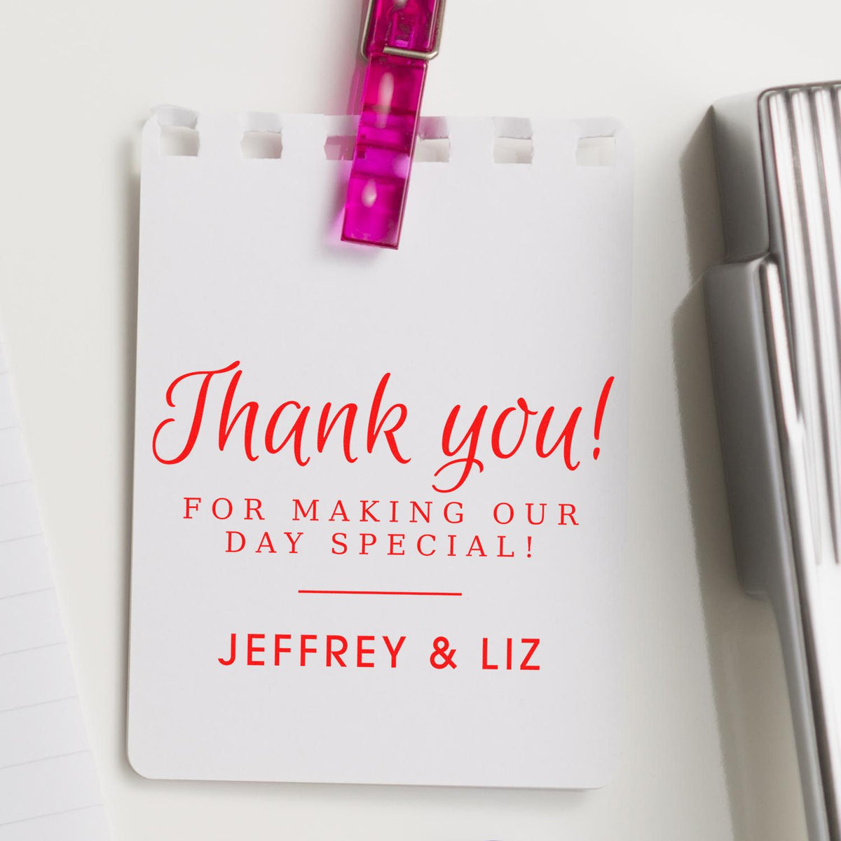 Custom thank-you stamp and seal card with red lettering, pink clip, and Jeffrey & Liz names on white background.