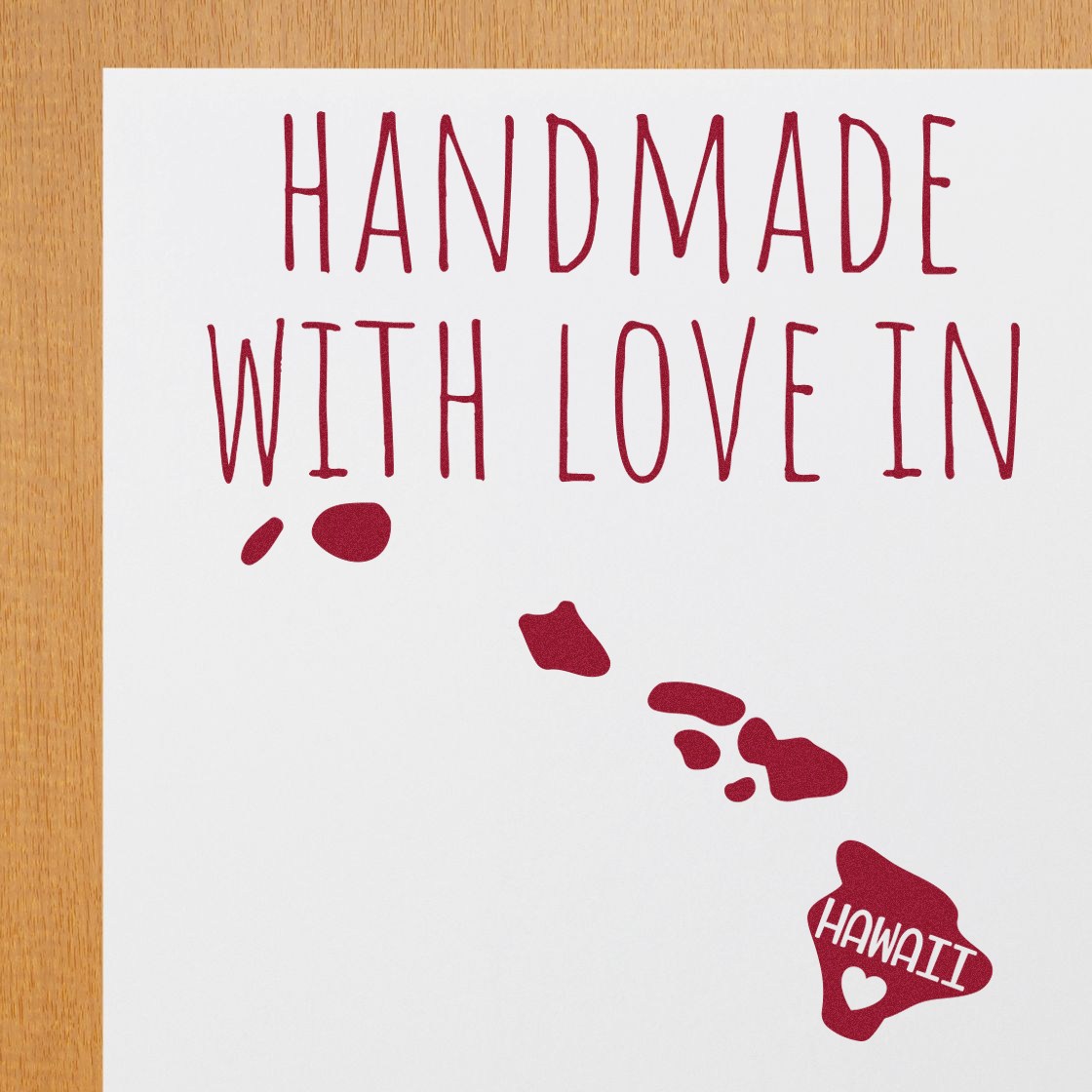 PSI Pre-Inked Handmade with Love in Hawaii stamp on white paper, featuring red text and a heart-shaped map of Hawaii. Perfect for adding a personal touch to crafts and gifts.