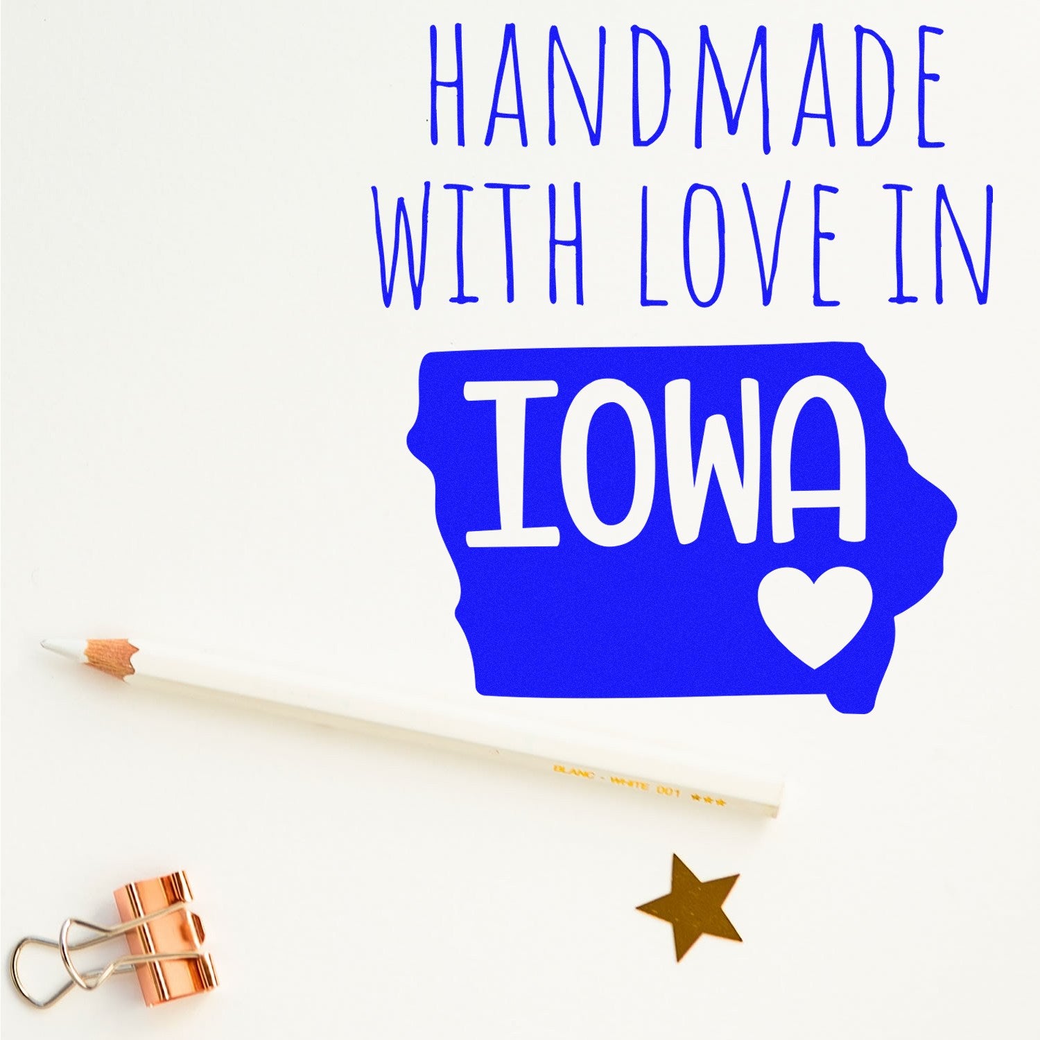 PSI Pre-Inked Handmade with Love in Iowa stamp on white background, featuring blue Iowa state outline with heart, pencil, gold star, and copper clip.