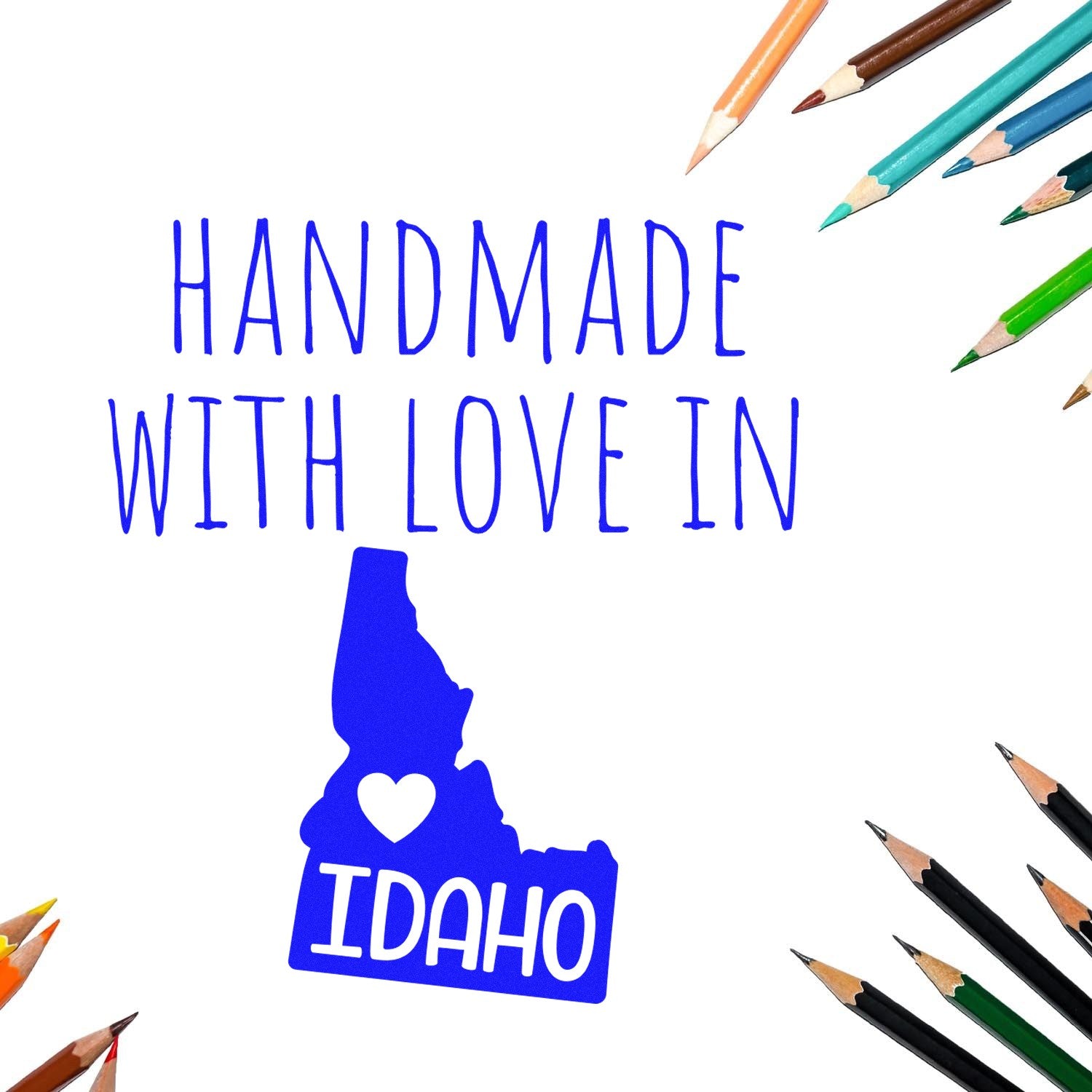 Self-Inking Idaho Handmade with Love Stamp featuring a blue Idaho state outline with a heart, surrounded by colorful pencils. Perfect for crafts and personalized projects.