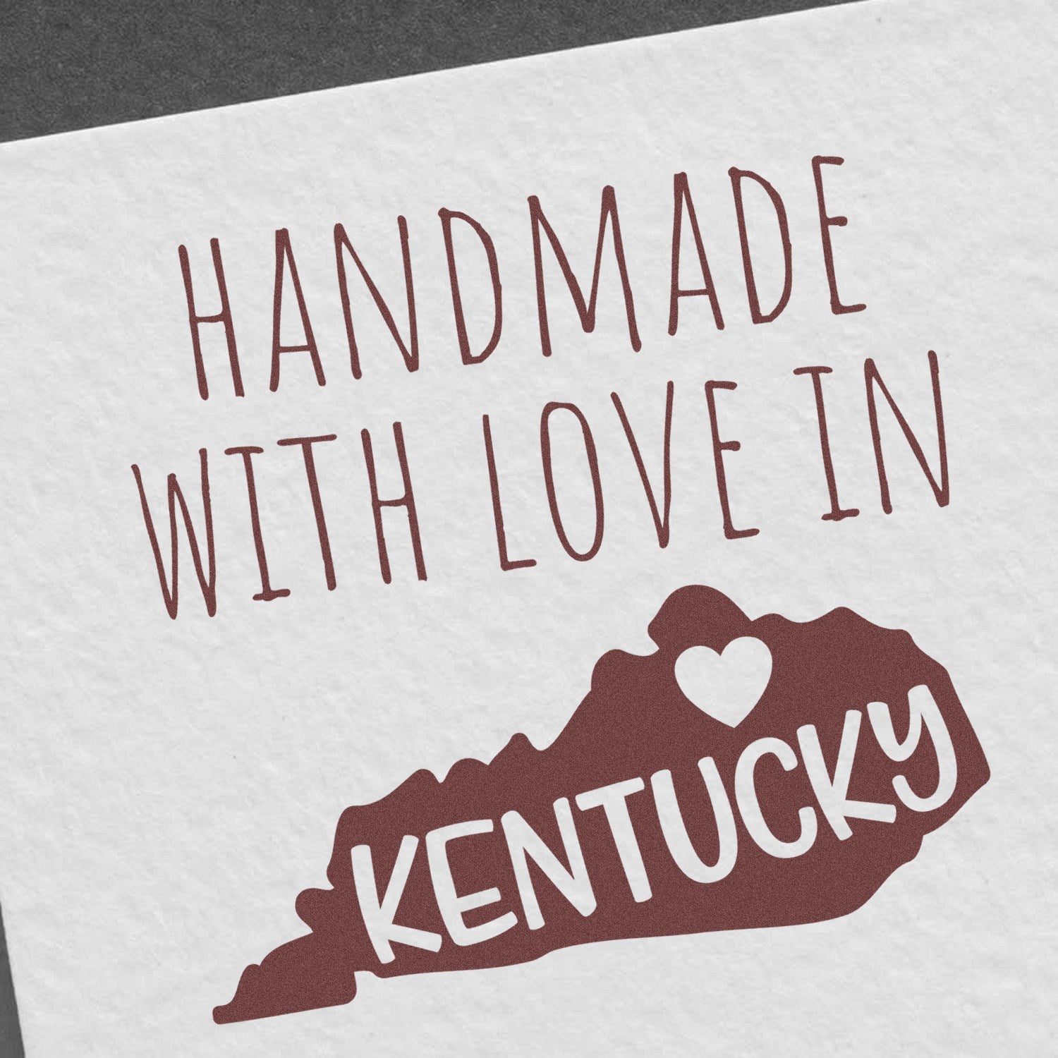 Handmade with Love in Kentucky Slim Pre-Inked Stamp featuring a heart and Kentucky state outline, perfect for adding a personal touch to crafts and gifts.