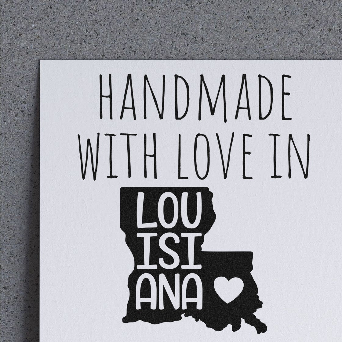 Wood Handle Louisiana Handmade with Love Rubber Stamp on gray background, featuring Handmade with Love in Louisiana text and state outline with heart. Perfect for crafts and gifts.