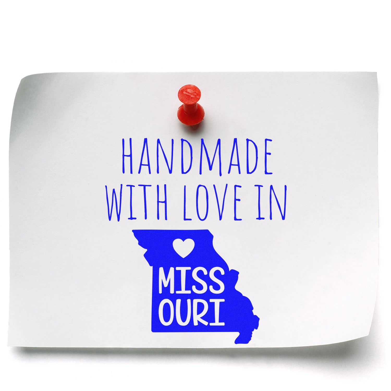 Self-Inking Missouri Handmade with Love Stamp on white paper with red pushpin, featuring blue text and Missouri state outline. Perfect for crafts and gifts.