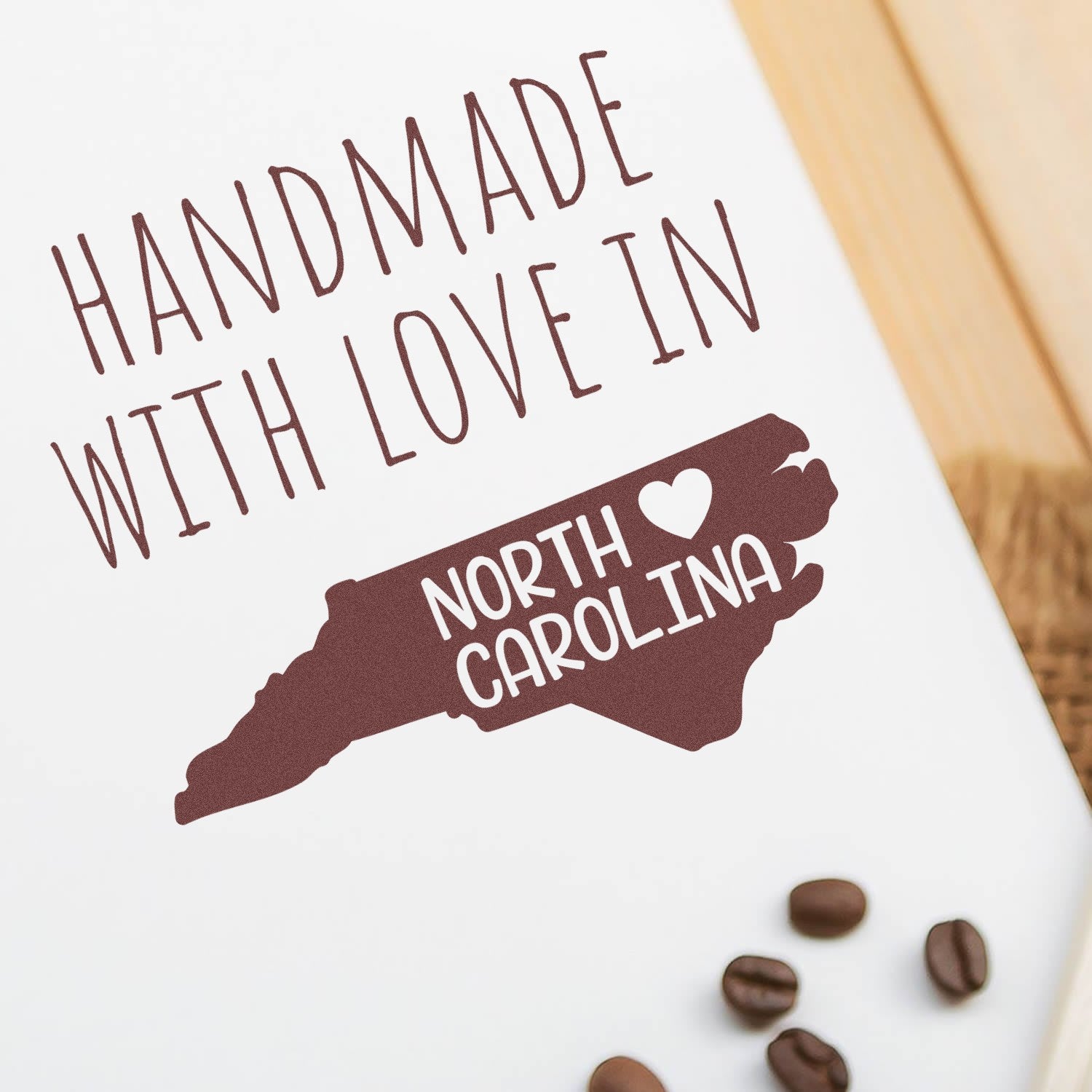 Wood Handle North Carolina Handmade with Love Rubber Stamp featuring a map outline and heart design, perfect for crafts and gifts. High-quality, artisanal craftsmanship.