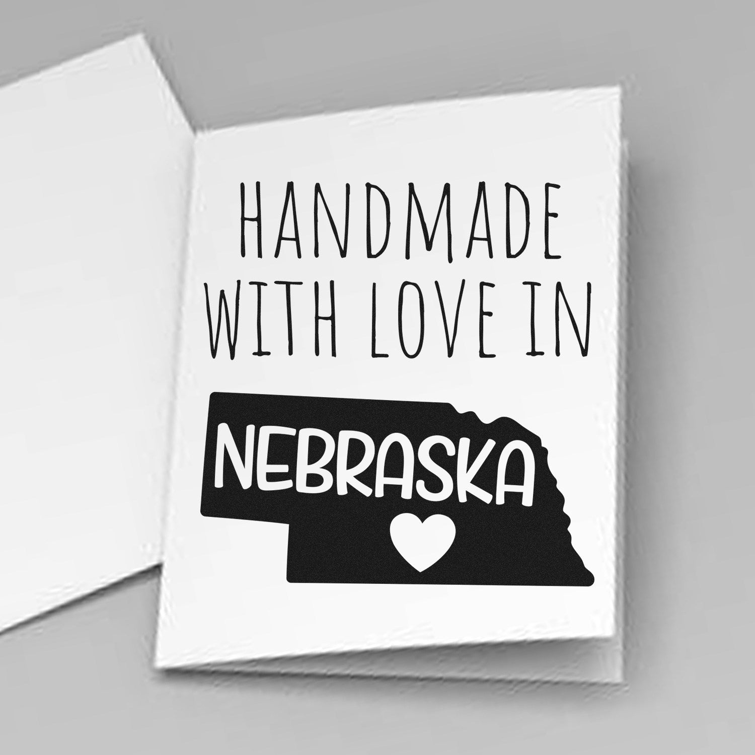 PSI Pre-Inked Handmade with Love in Nebraska stamp on white card, featuring Nebraska state outline and heart design.