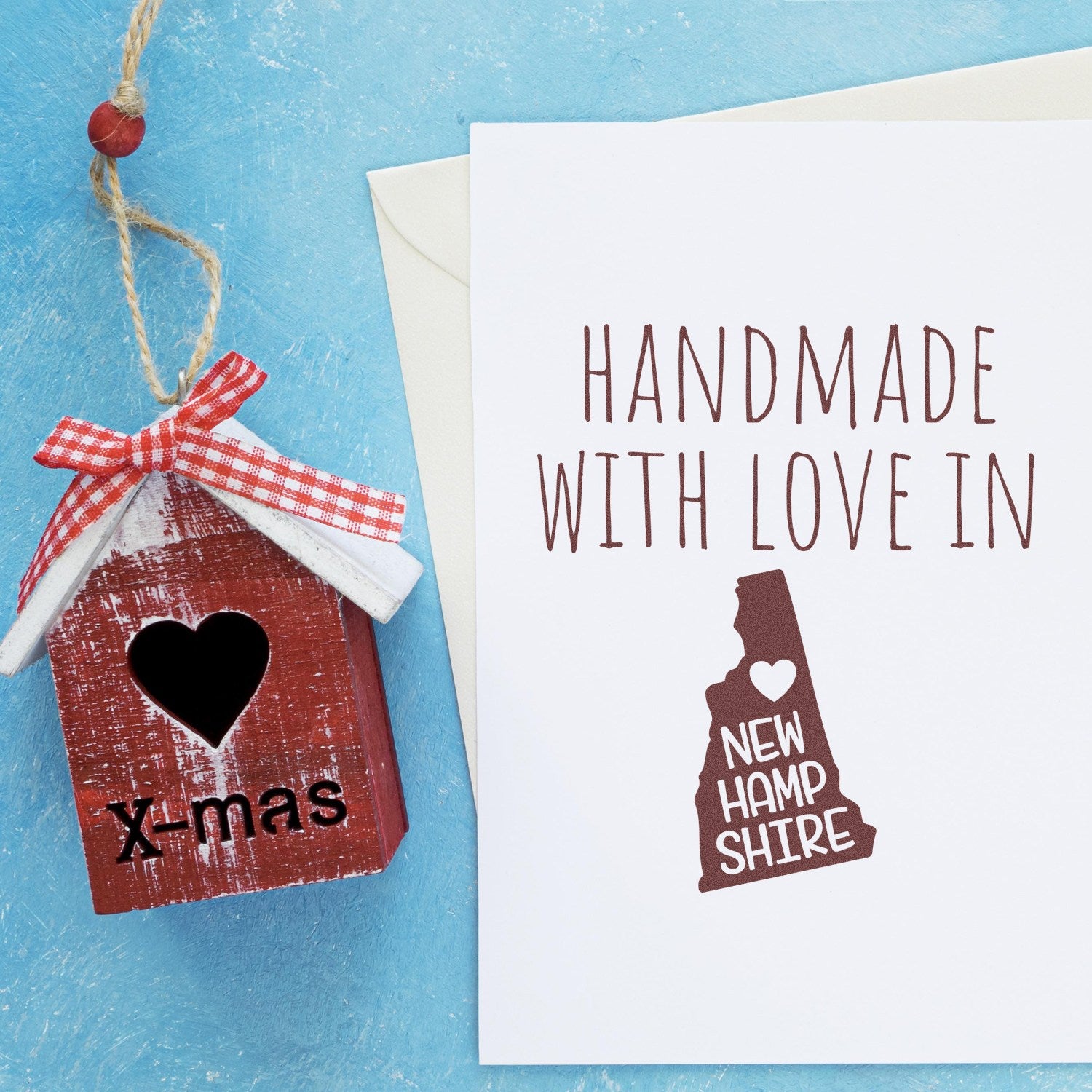 Self-Inking New Hampshire Handmade with Love Stamp on a card, featuring a heart and state outline, perfect for crafts and gifts.