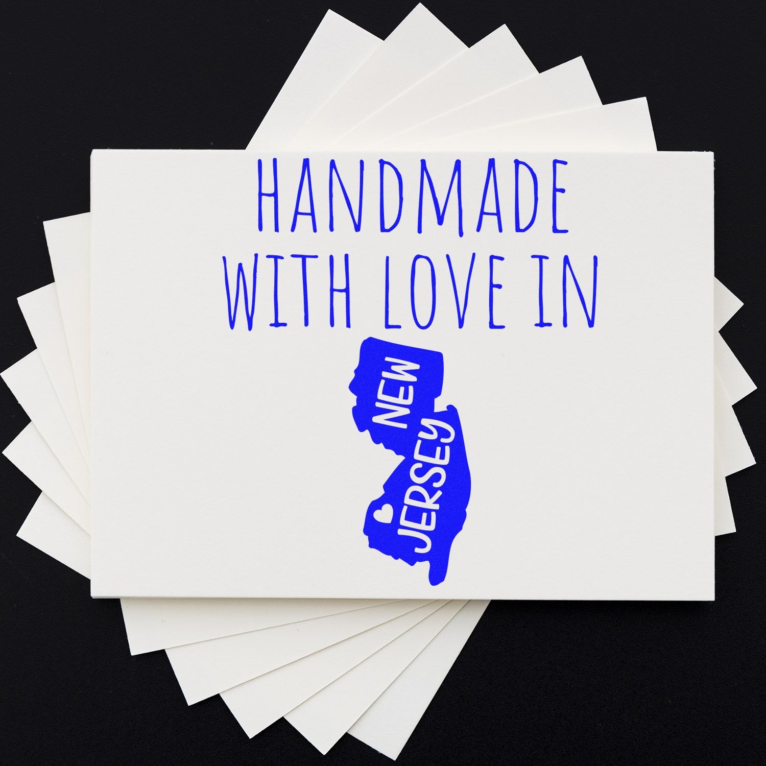 Image of the Wood Handle New Jersey Handmade with Love Rubber Stamp, featuring a wooden handle and a stamp design of New Jersey with Handmade with Love text in blue.