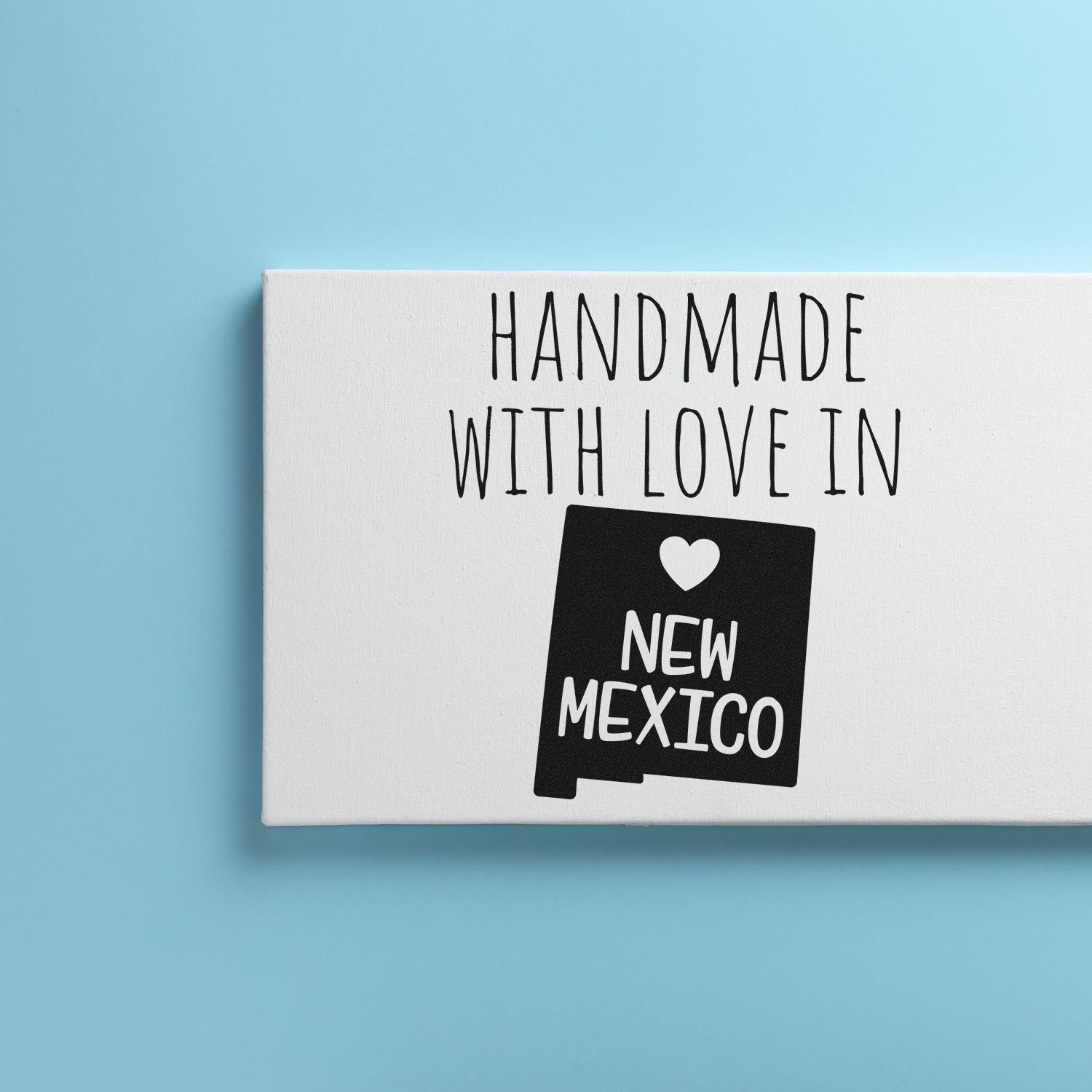 Self-Inking New Mexico Handmade with Love Stamp on blue background, featuring a heart and New Mexico text, perfect for crafts and gifts.