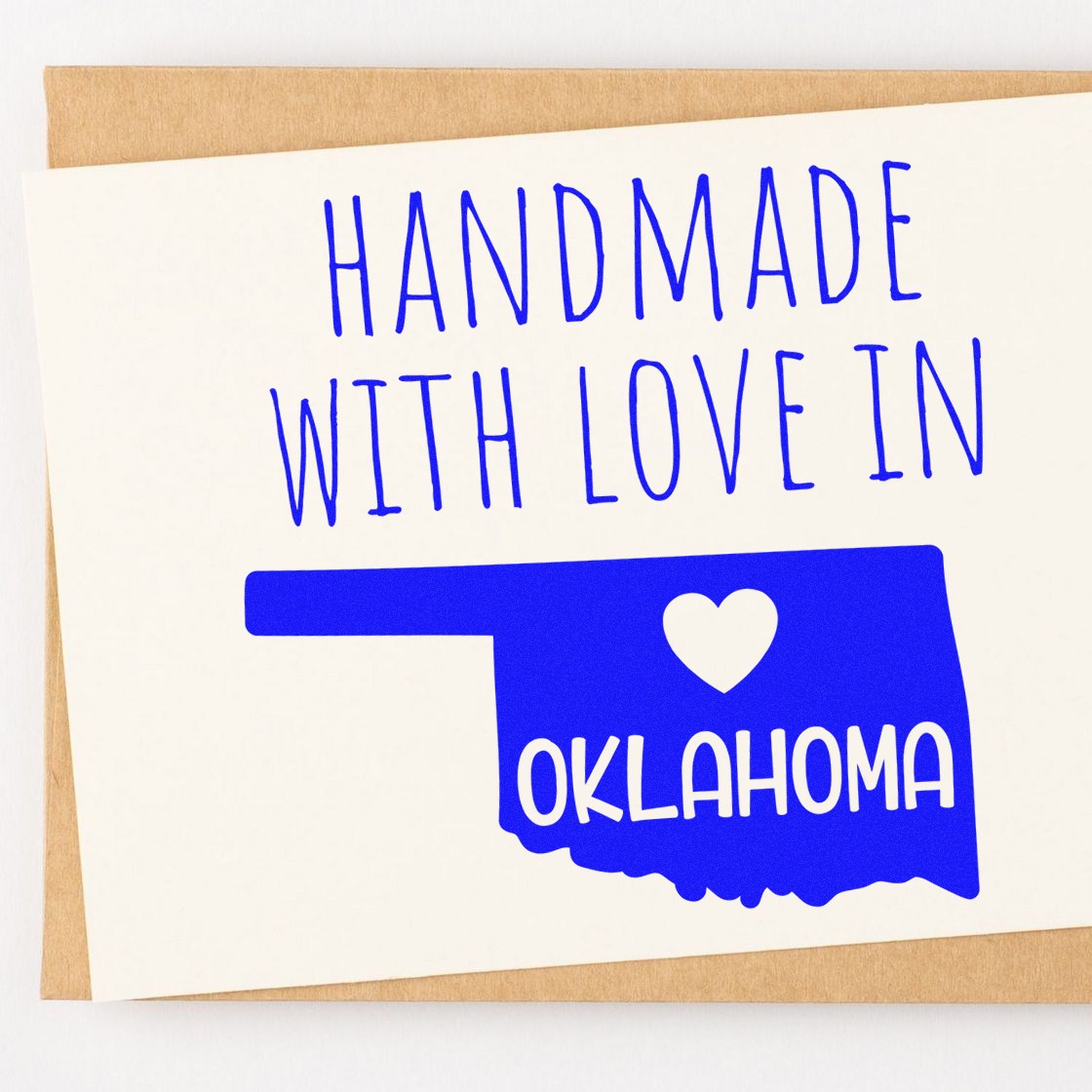 Self-Inking Oklahoma Handmade with Love Stamp featuring a blue Oklahoma state outline with a heart and Handmade with Love text, perfect for crafts and gifts.