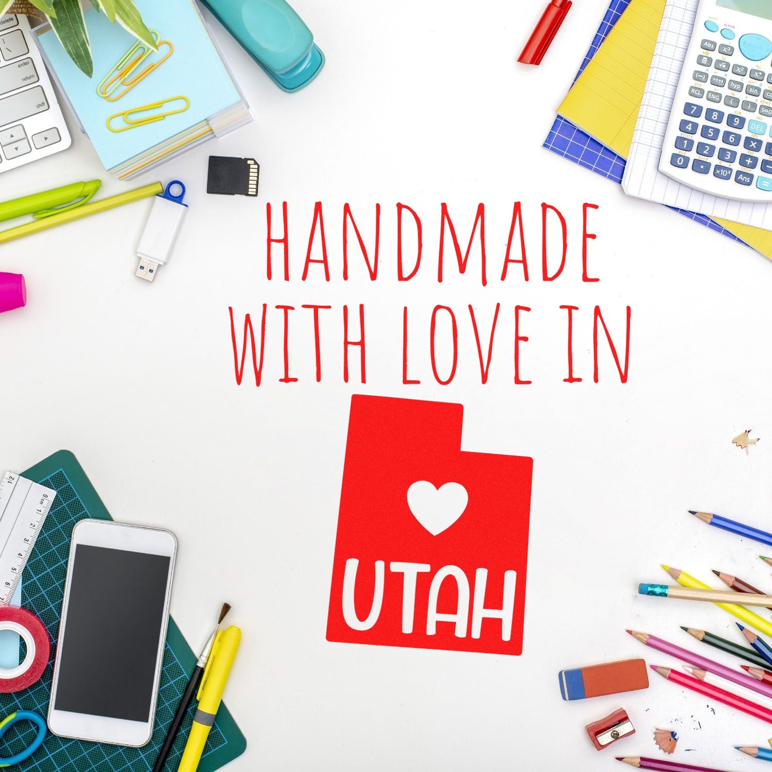 Wood Handle Utah Handmade with Love Rubber Stamp on a desk with colorful stationery, featuring a red stamp design with a heart and 'UTAH' text.