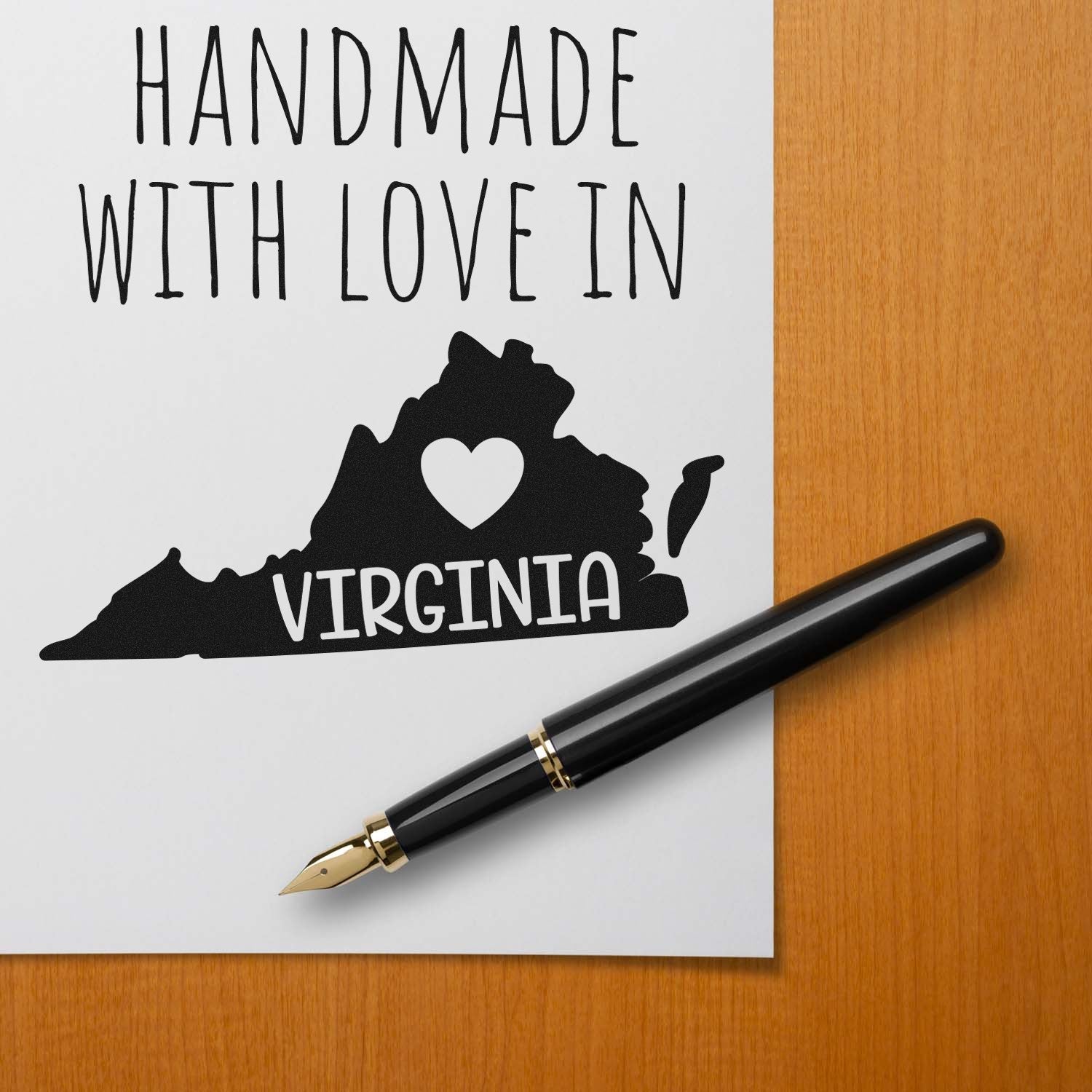 Wood Handle Virginia Handmade with Love Rubber Stamp on paper with Handmade with Love in Virginia text and state silhouette. Perfect for crafts and personalized projects.