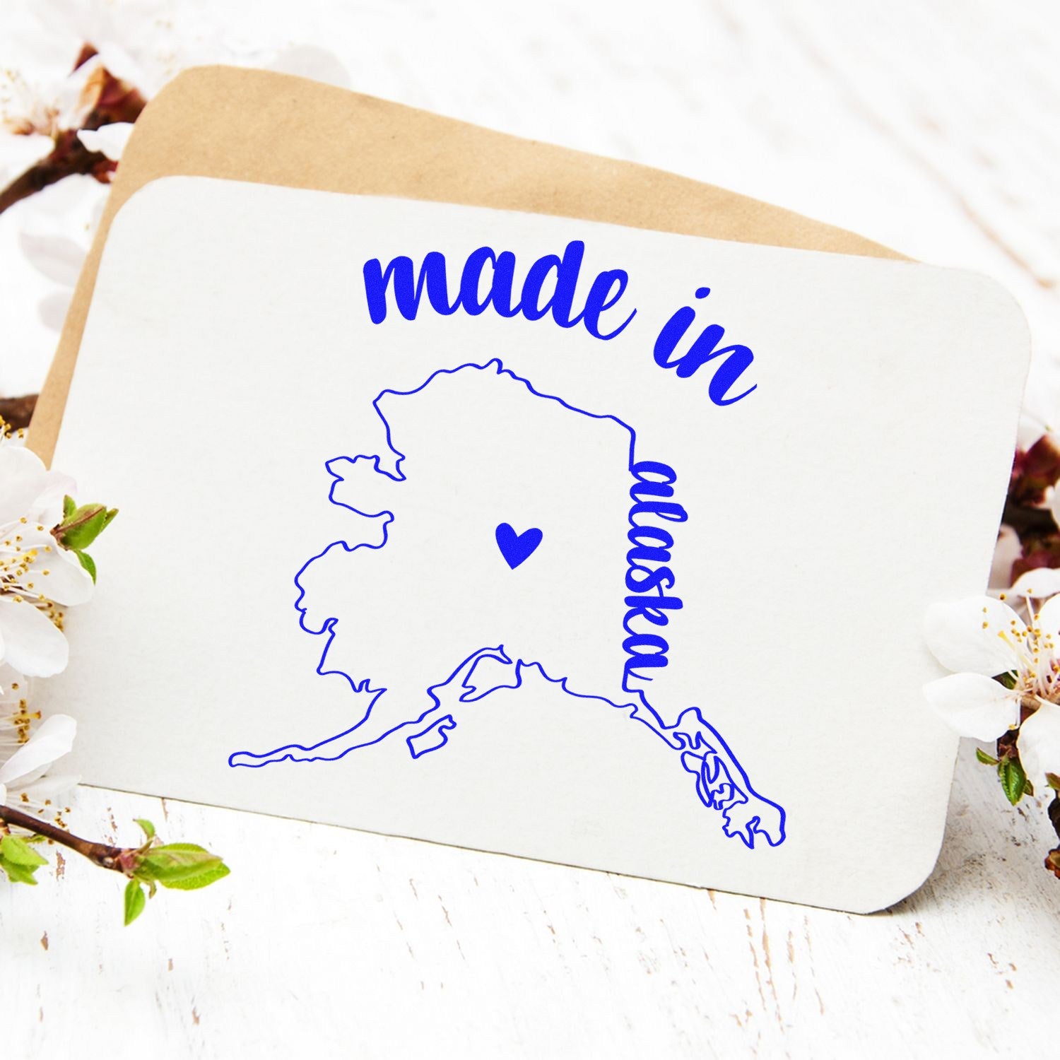 Self-Inking Handmade with Love in Alaska Stamp featuring a blue map of Alaska with a heart, perfect for adding a personal touch to cards and crafts.