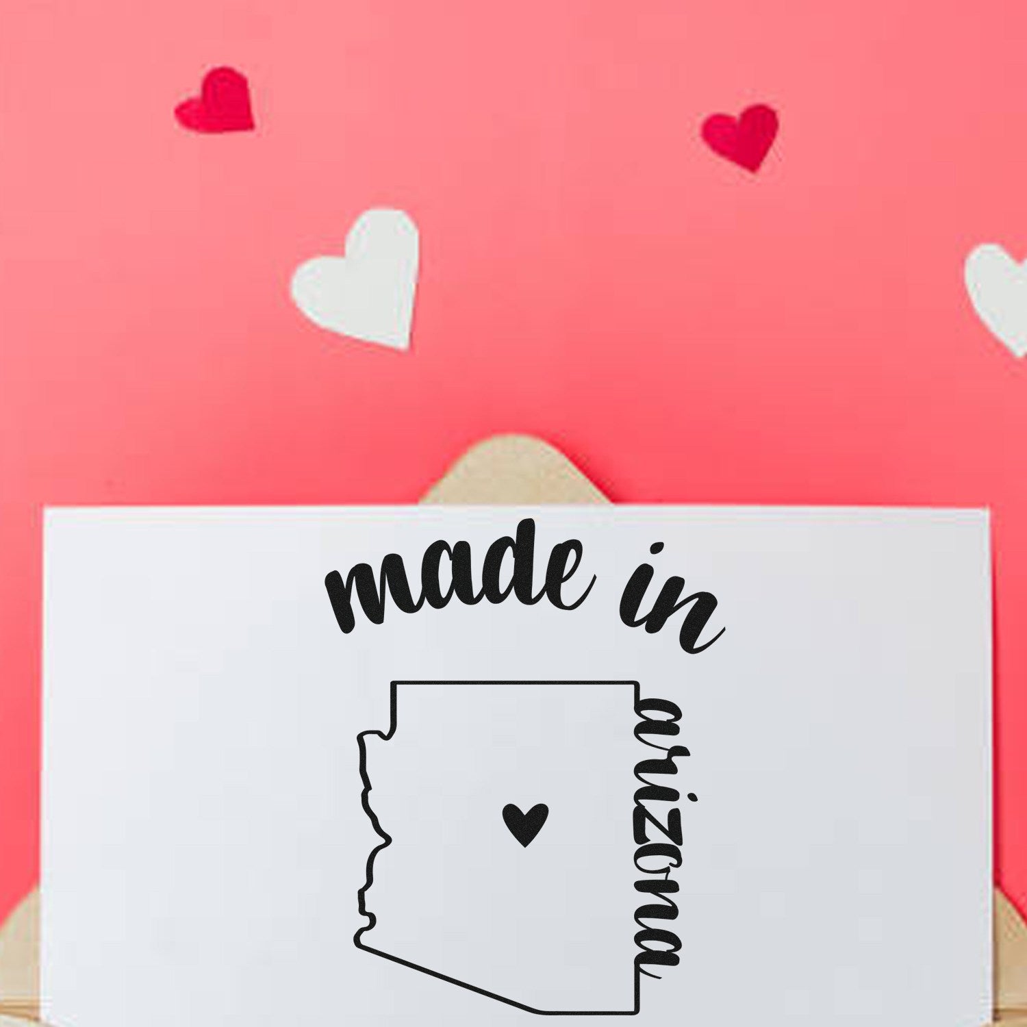 Made in Arizona Stamp Pre-Inked on a white card with a pink background and heart decorations, featuring a map outline and heart design.