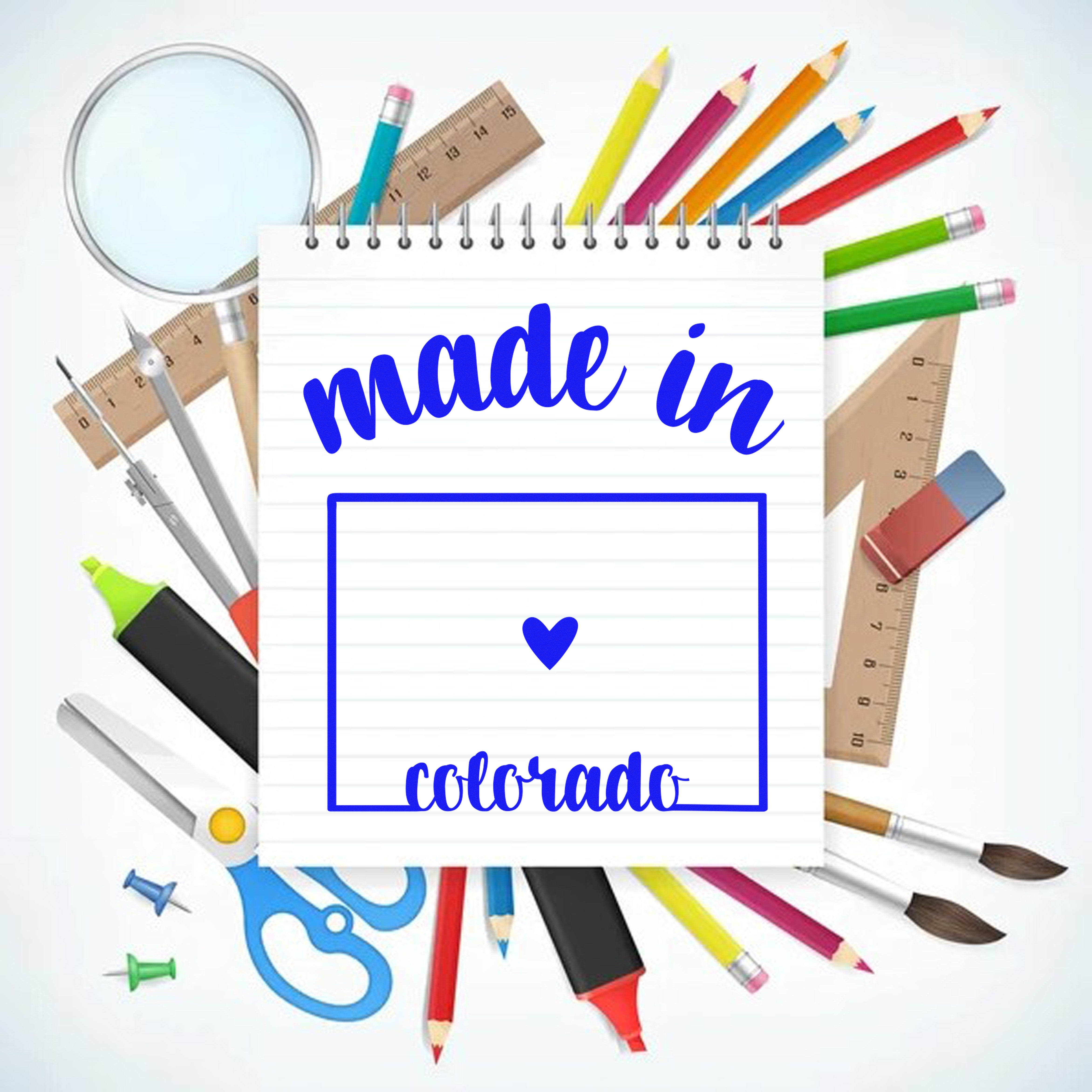 Made with Love in Colorado Rubber Stamp on a notepad surrounded by colorful stationery, including pencils, scissors, and rulers. Perfect for crafts and personalized projects.