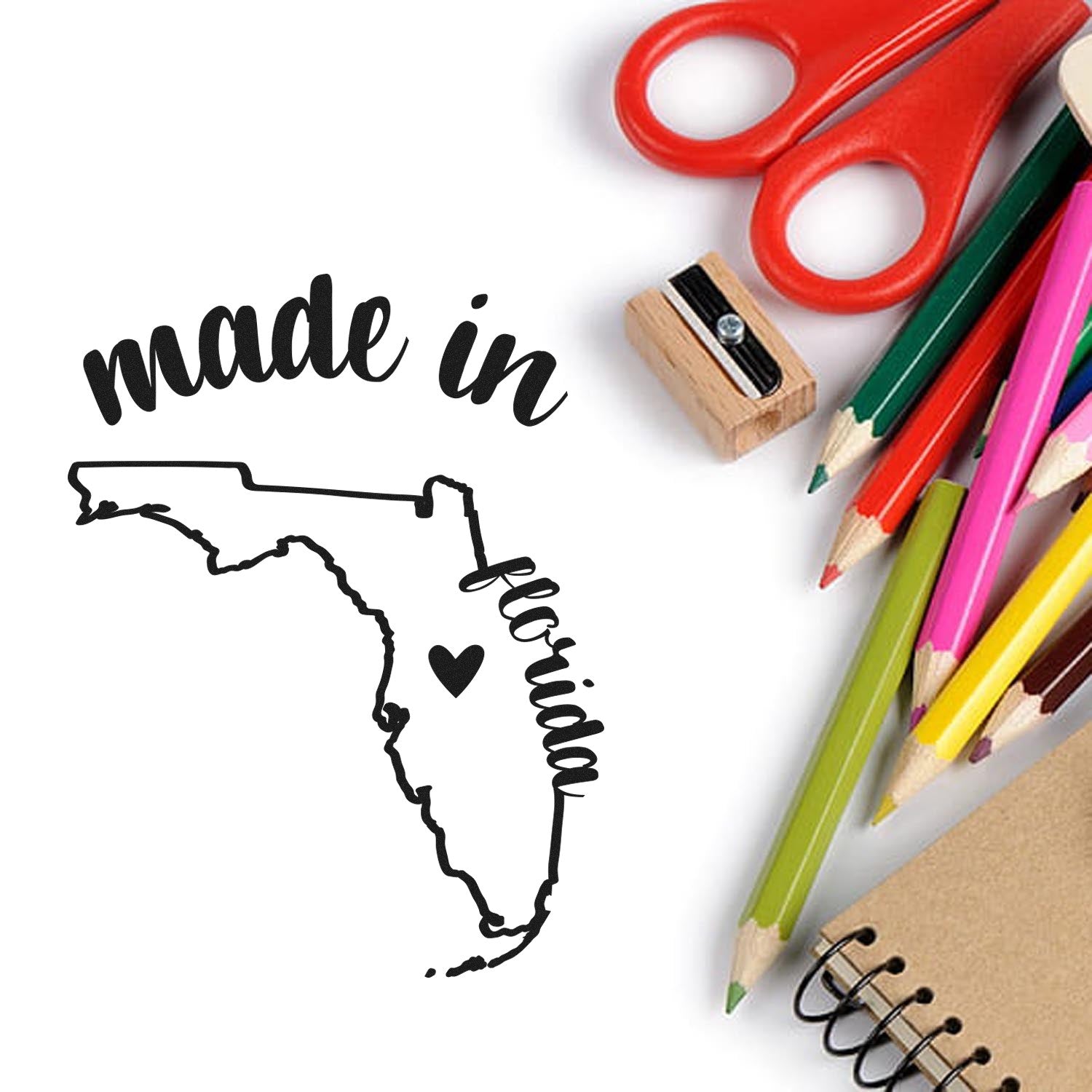 Self-Inking Handmade with Love in Florida Stamp featuring a Florida map design with heart, surrounded by colorful pencils and scissors. Perfect for crafts and gifts.