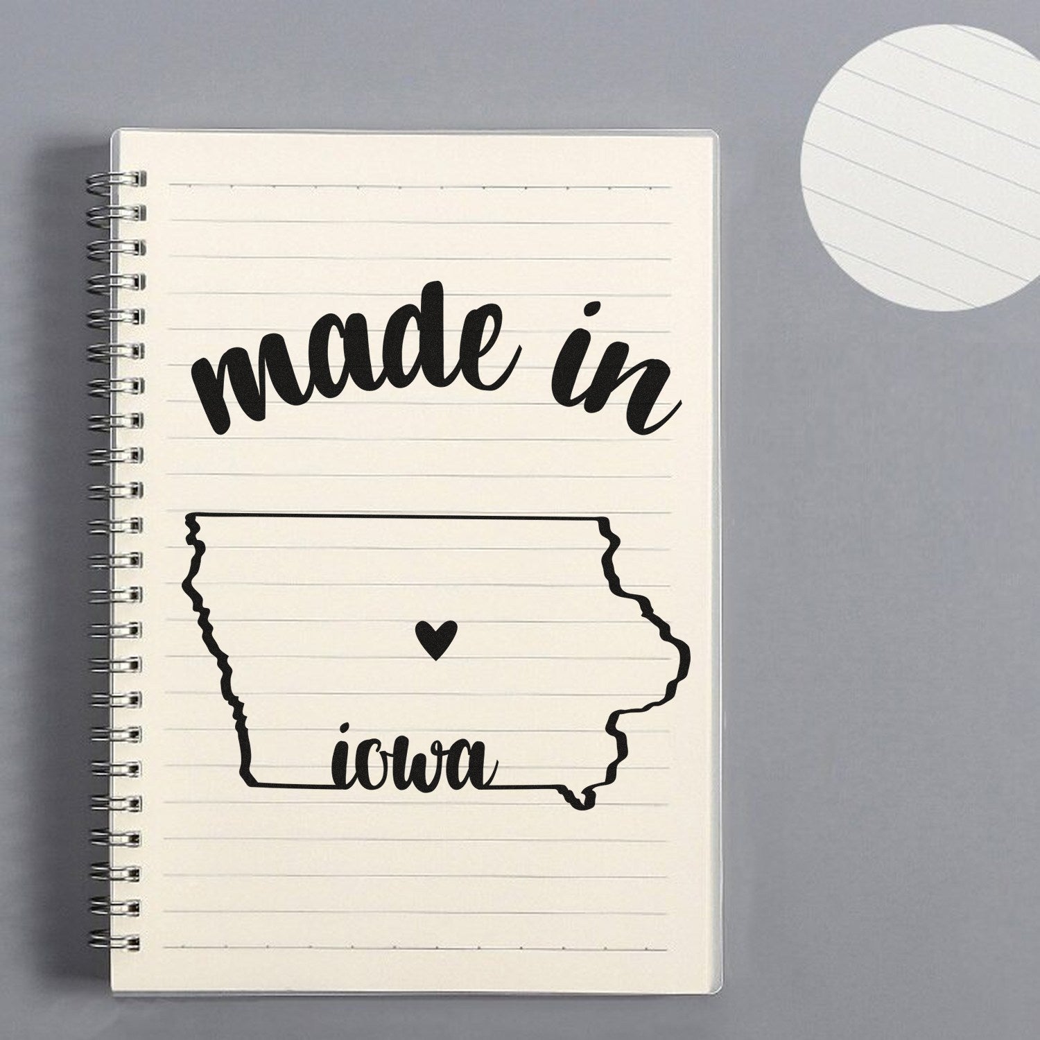 Self-Inking Handmade with Love in Iowa Stamp on a notebook, featuring 'made in Iowa' text with a heart inside the state outline. Perfect for crafts and personalized projects.