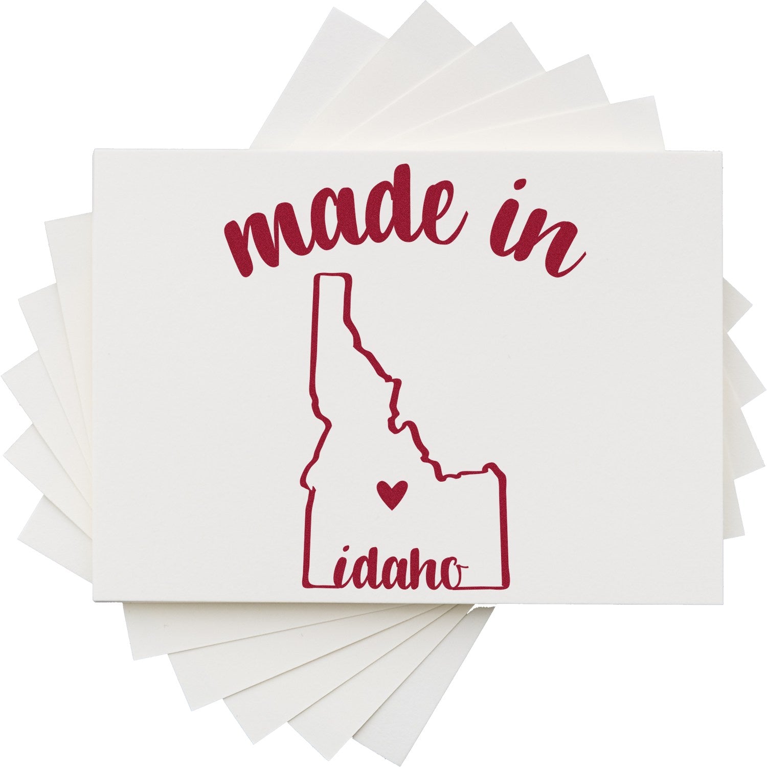 Made in Idaho Stamp Pre-Inked featuring a red outline of Idaho with 'made in' text above and 'idaho' below, perfect for adding a local touch to stationery and crafts.