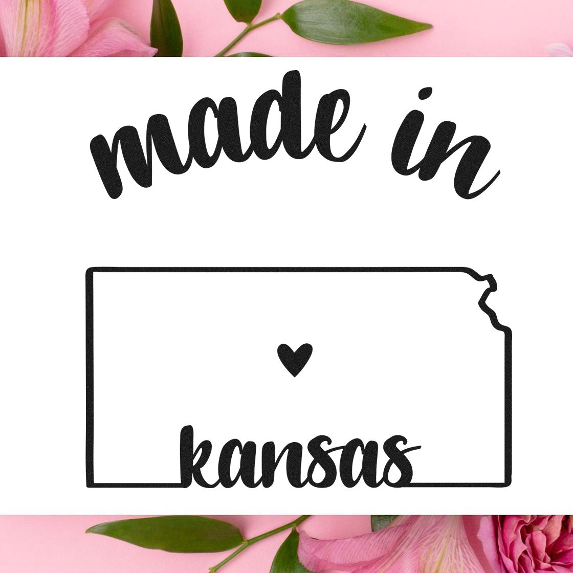 Self-Inking Handmade with Love in Kansas Stamp featuring 'made in kansas' text and heart inside Kansas outline, surrounded by pink flowers and green leaves.