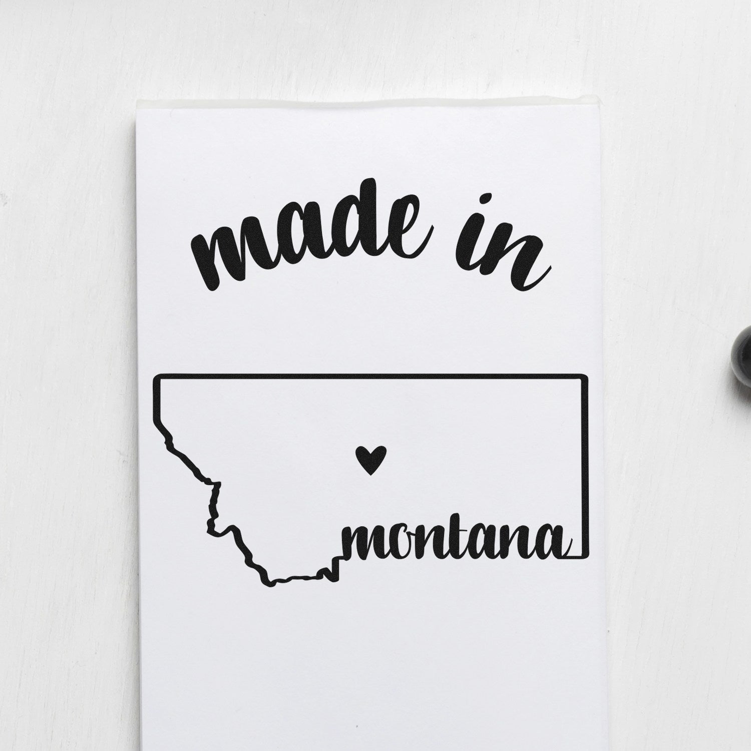 Made with Love in Montana Rubber Stamp featuring a heart inside the state outline, with 'made in' and 'Montana' text on a white background.