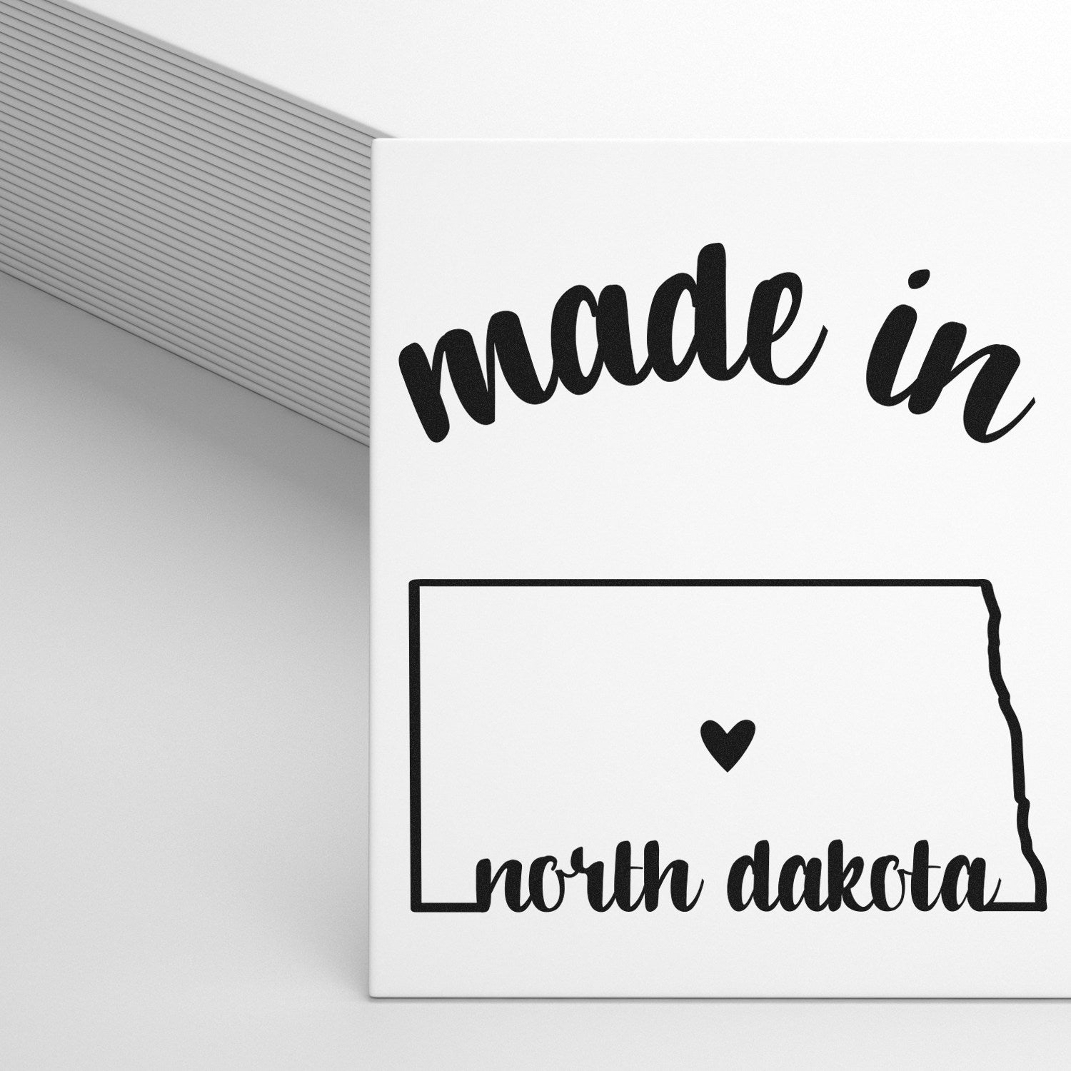 Self-Inking Handmade with Love in North Dakota Stamp featuring a heart and state outline design, perfect for adding a personal touch to crafts and gifts.