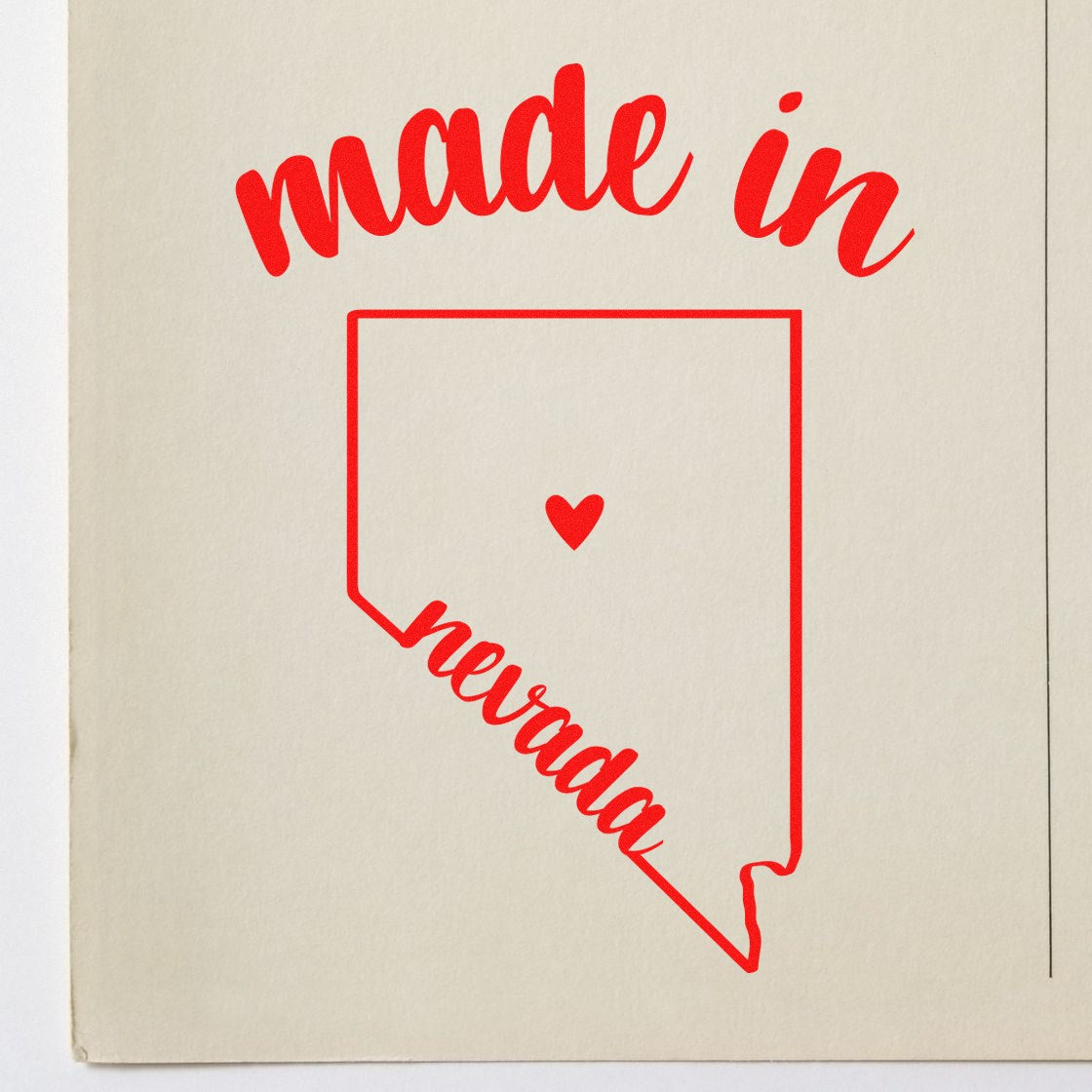 Made with Love in Nevada Rubber Stamp featuring red text and heart design on a beige background, highlighting the state outline and 'made in Nevada' message.