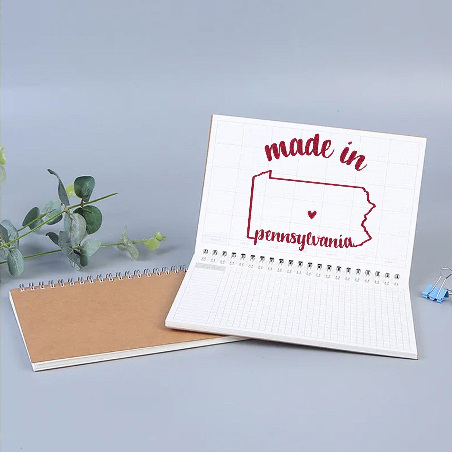 Self-Inking Handmade with Love in Pennsylvania Stamp on open notebook, featuring a red outline of Pennsylvania with 'made in Pennsylvania' text. Ideal for crafts and personalized projects.