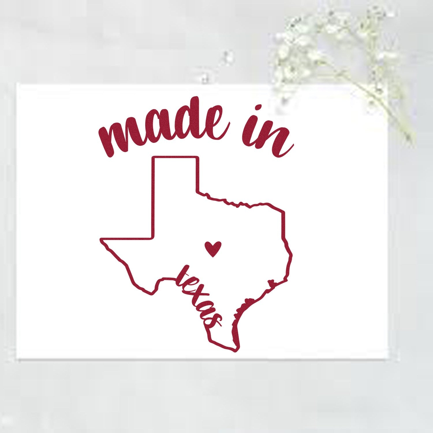 Self-Inking Handmade with Love in Texas Stamp featuring a red outline of Texas with a heart, and 'made in Texas' text, perfect for crafts and gifts. White background with floral accent.