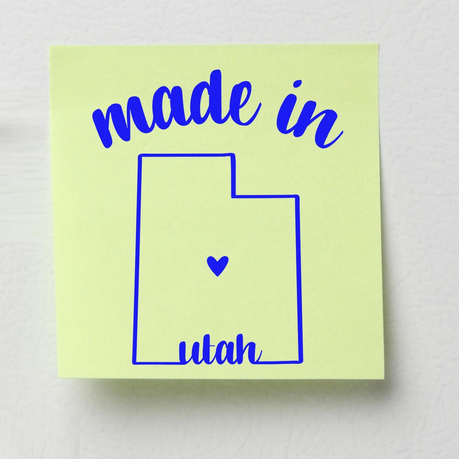 Self-Inking Handmade with Love in Utah Stamp featuring a blue outline of Utah with a heart, and 'made in Utah' text on a light green background.