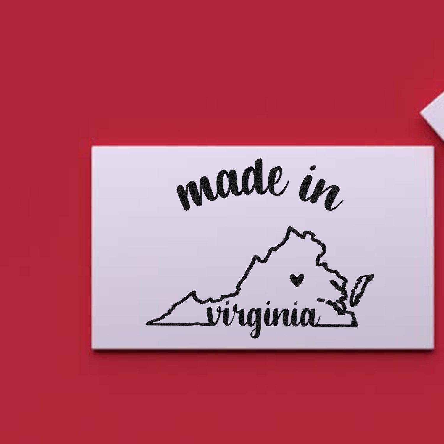 Self-Inking Handmade with Love in Virginia Stamp on red background, featuring made in Virginia text with state outline and heart. Perfect for crafts and gifts.