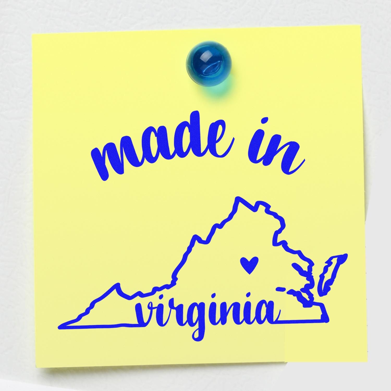 Self-Inking Handmade with Love in Virginia Stamp on yellow paper, featuring blue text and a Virginia state outline with a heart. Perfect for crafts and gifts.