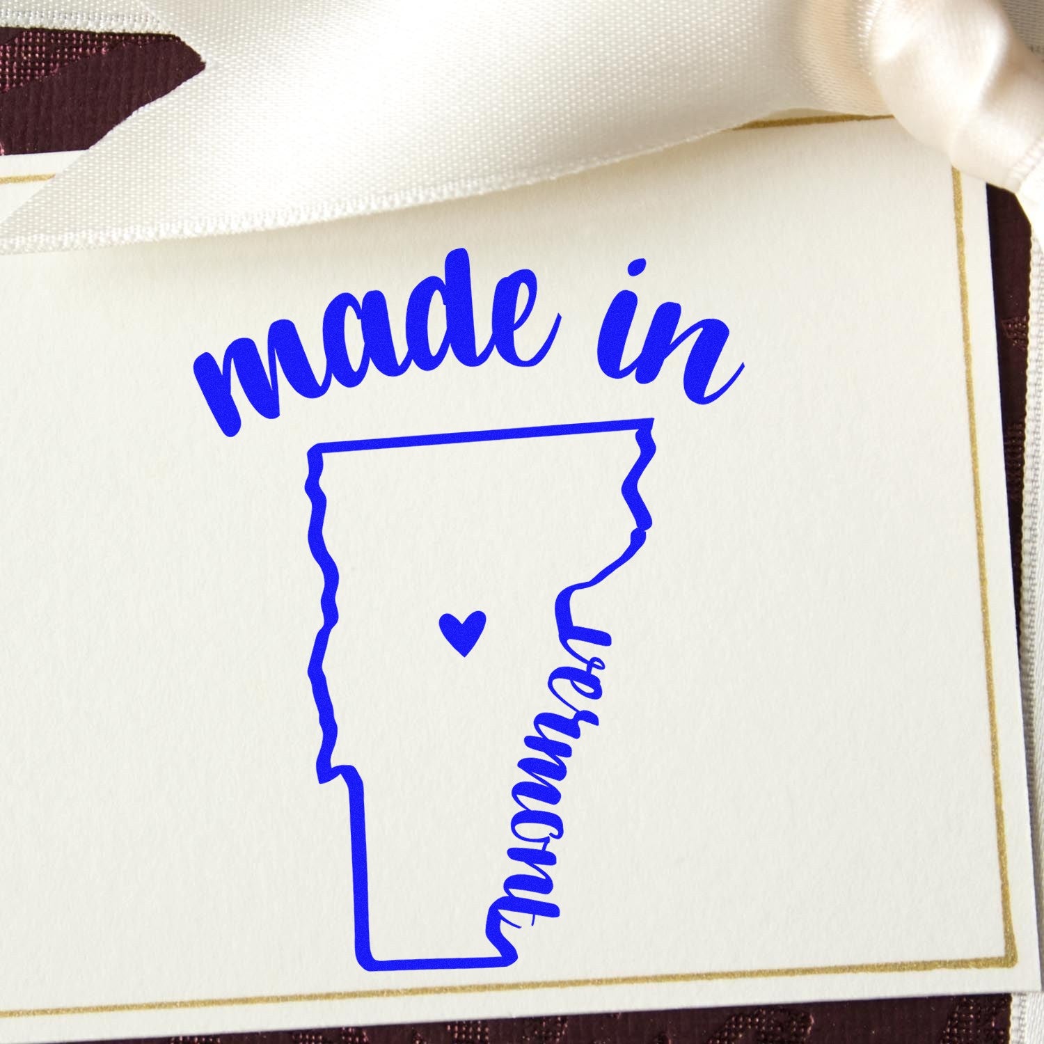 Self-Inking Handmade with Love in Vermont Stamp featuring a blue outline of Vermont with a heart, perfect for adding a personal touch to crafts and gifts.