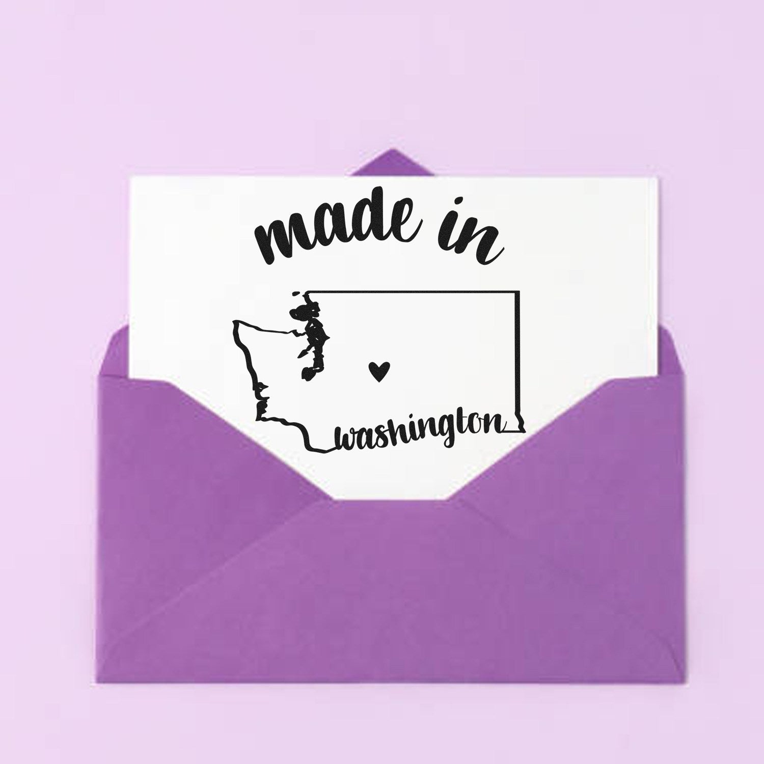 Made with Love in Washington Rubber Stamp featuring a heart and state outline, displayed on a card in a purple envelope against a light purple background.