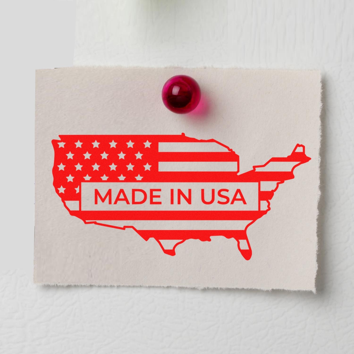 Wood Handle Patriotic USA Seal Rubber Stamp featuring a red Made in USA design on a map outline with stars and stripes, pinned to a surface. Perfect for crafting and official use.