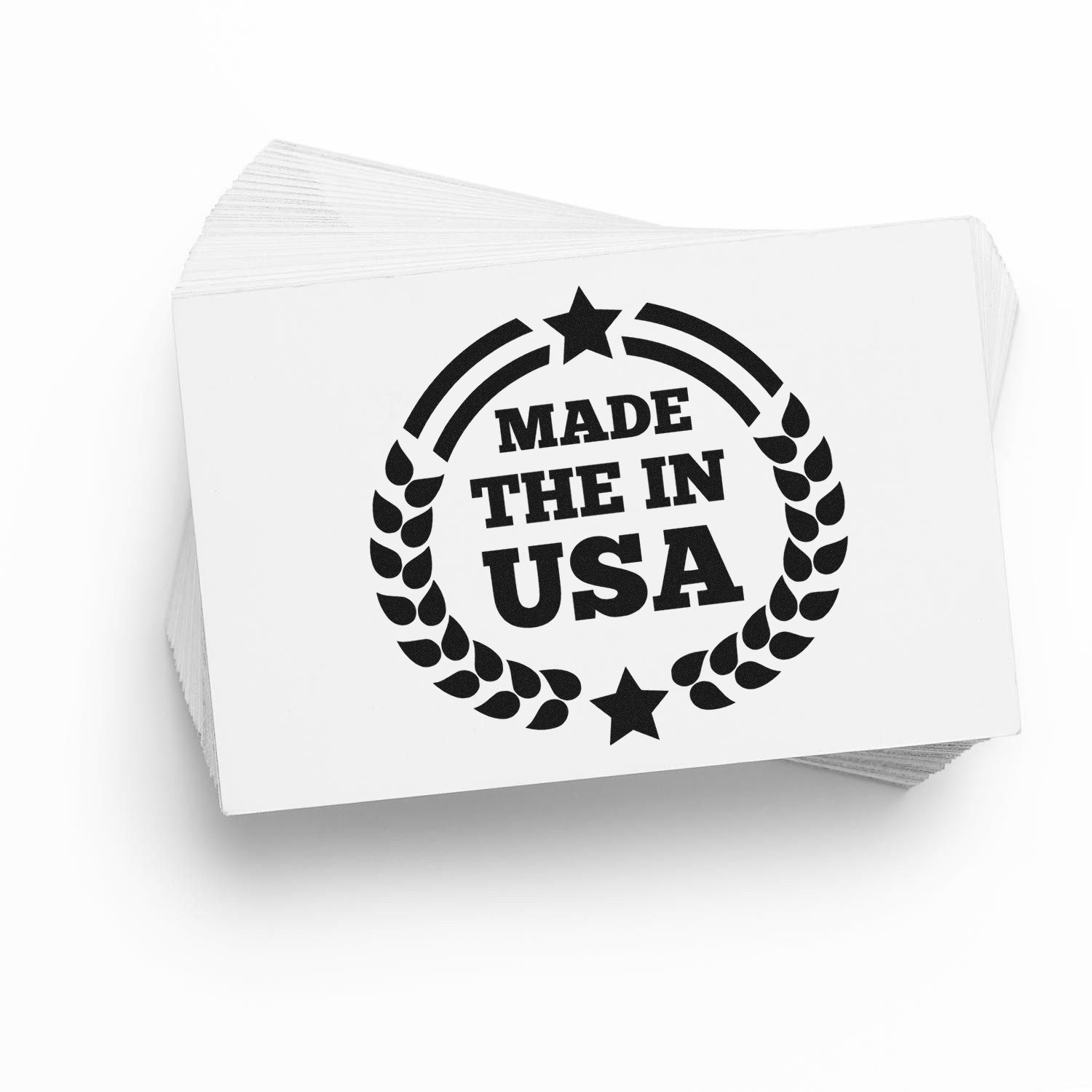 Self-Inking Made In The USA Proudly Stamp with bold black text and star design on a white card stack, showcasing American craftsmanship.