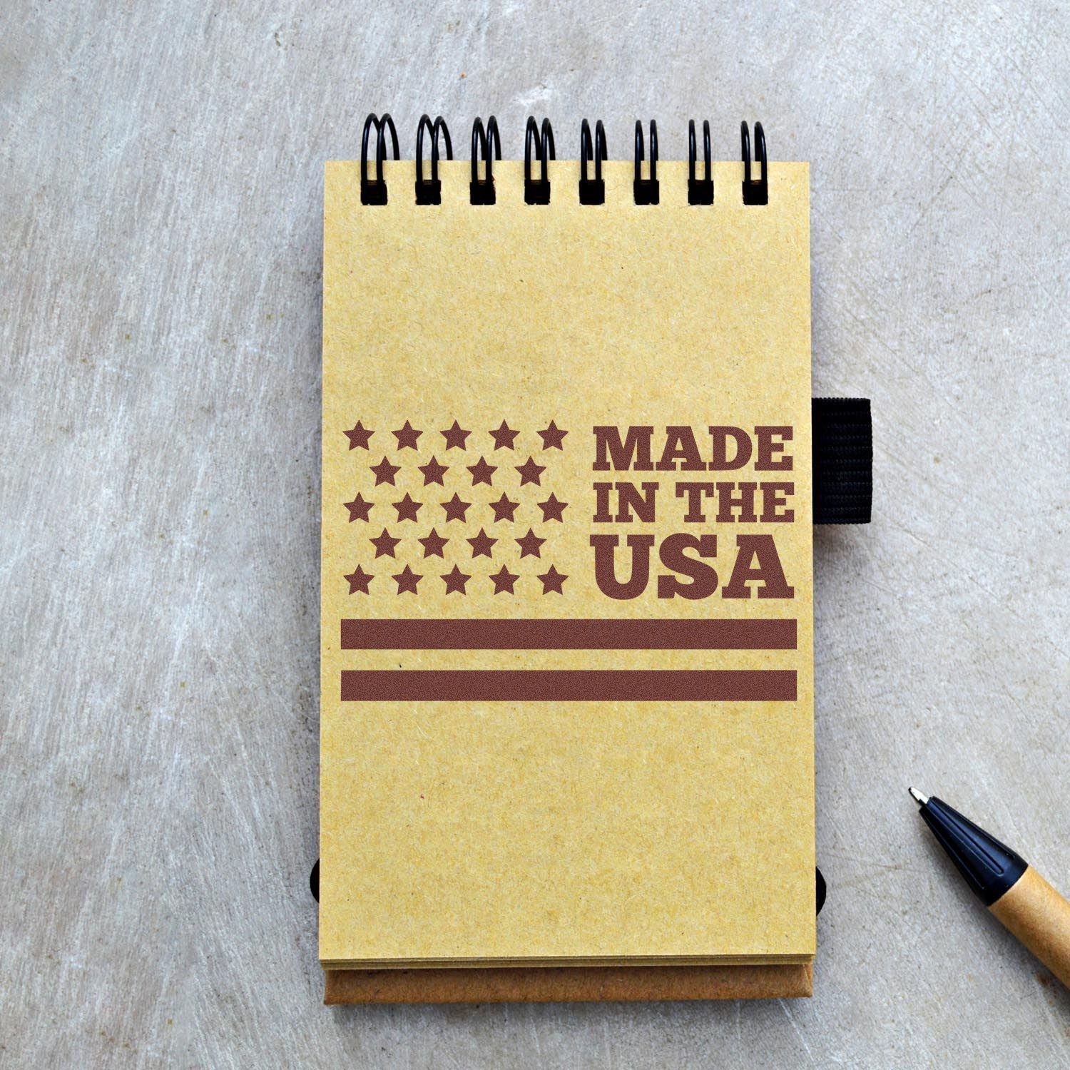 Image of the PSI Pre-Inked Patriot Pride Stamp, featuring a Made in the USA design on a spiral notebook, showcasing its crisp, detailed imprint.