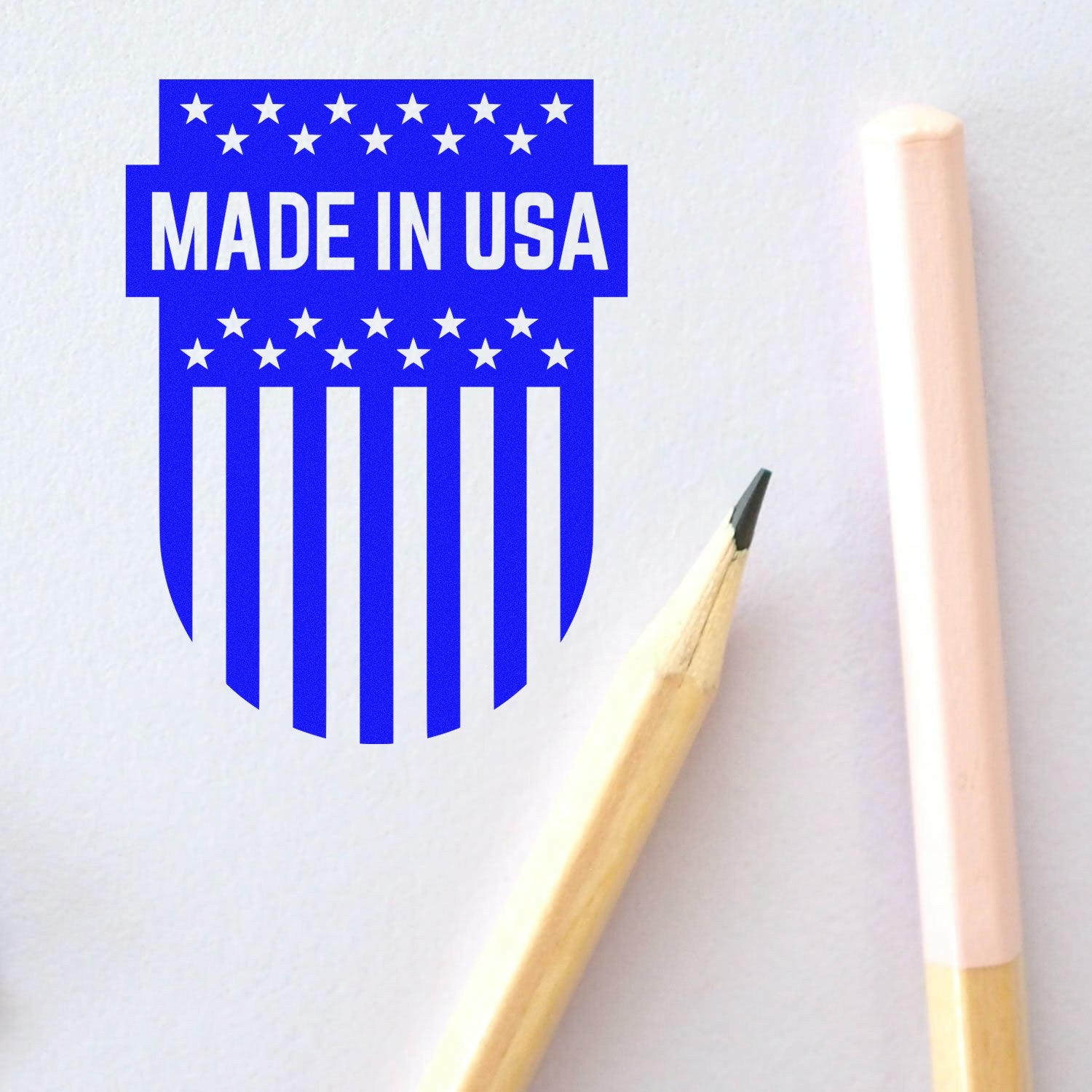 Wood Handle Patriotic Emblem Rubber Stamp with Made in USA design, featuring stars and stripes. Ideal for crafting and stationery.