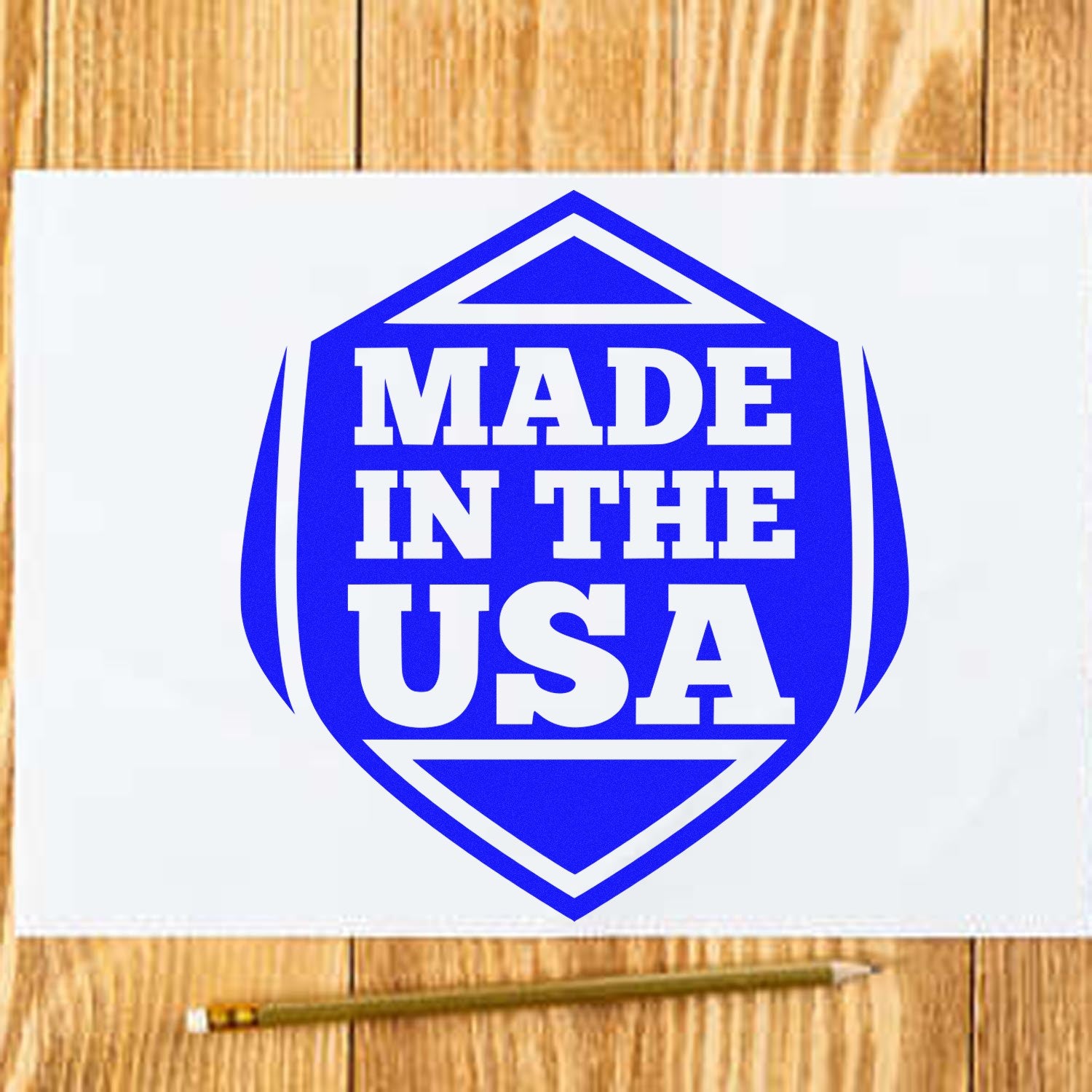 Self-Inking American Pride Seal Stamp with 'Made in the USA' design in bold blue on a wooden surface, showcasing patriotic craftsmanship.