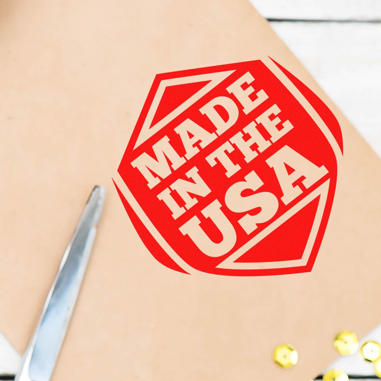 Slim Pre-Inked American Pride Seal Stamp with bold red Made in the USA design on a beige surface, showcasing precision and patriotic style. Perfect for adding a professional touch.