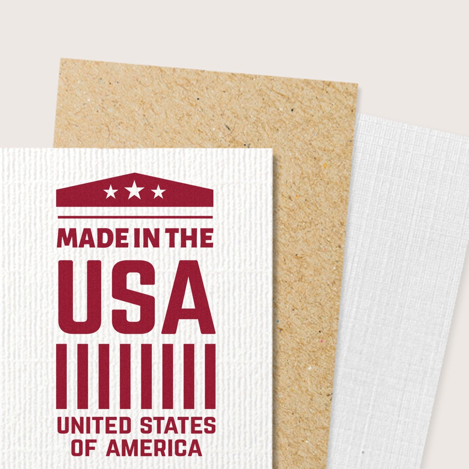 Self-Inking American Pride Emblem Stamp featuring a bold Made in the USA design with stars and stripes, shown on textured paper. Perfect for patriotic crafts and stationery.