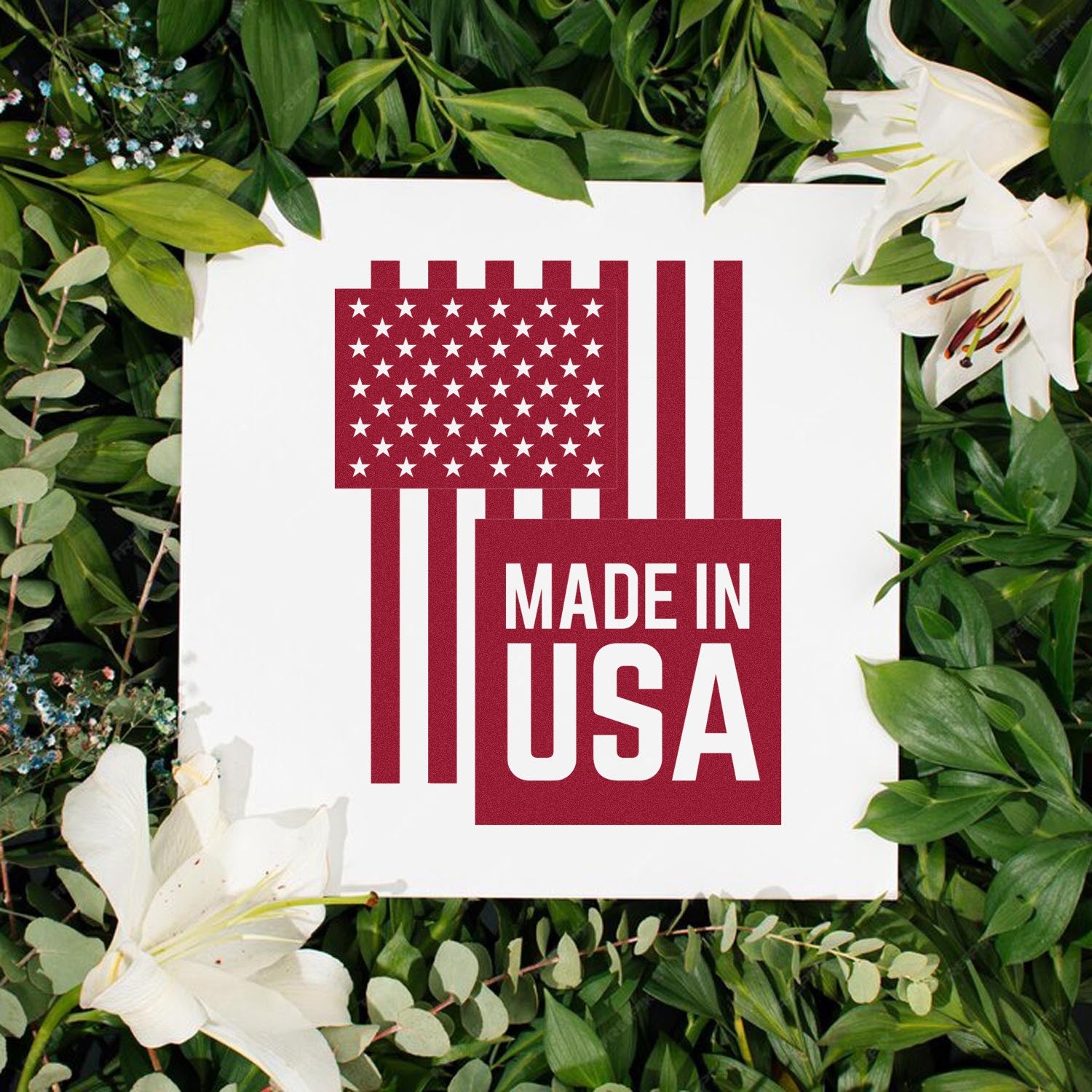 Wood Handle USA Patriotic Pride Rubber Stamp featuring a Made in USA design with stars and stripes, set against a backdrop of lush green leaves and white lilies.