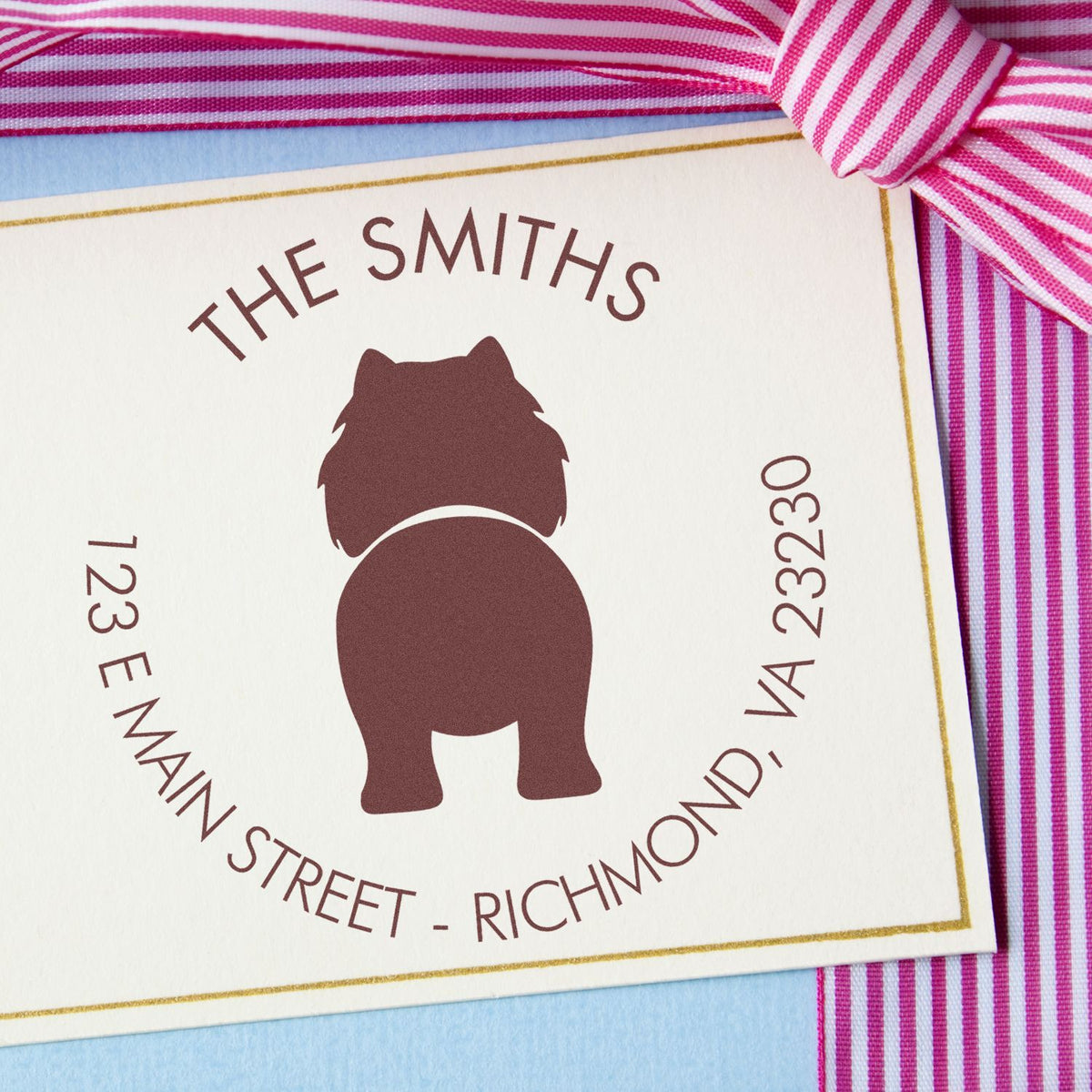 Custom brown dog seal stamp on cream card with gold border, pink striped ribbon, and THE SMITHS text.