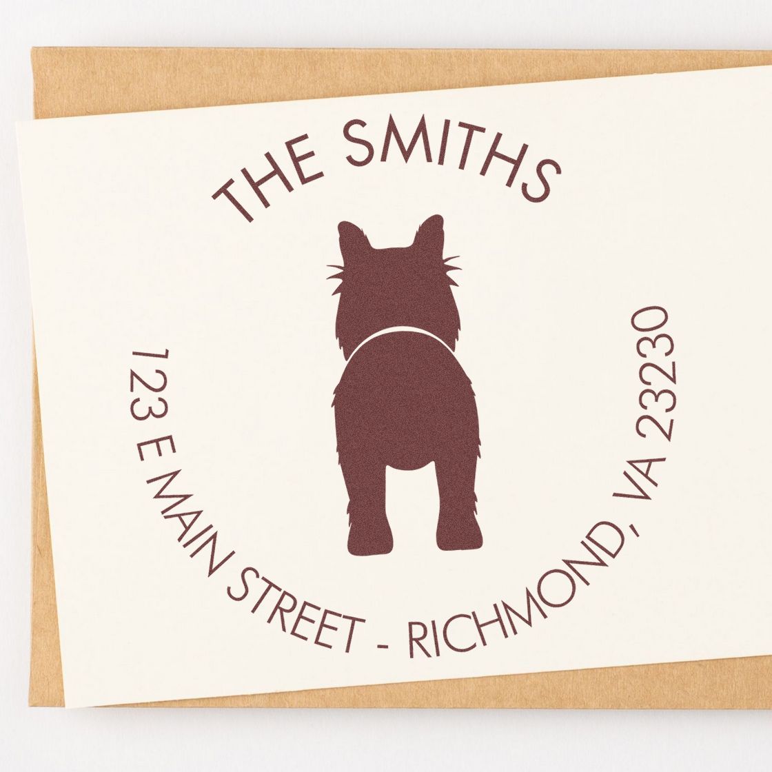 Personalized maroon address stamp and seal with dog silhouette on cream cardstock, reading The Smiths, 123 E Main Street, Richmond, VA.