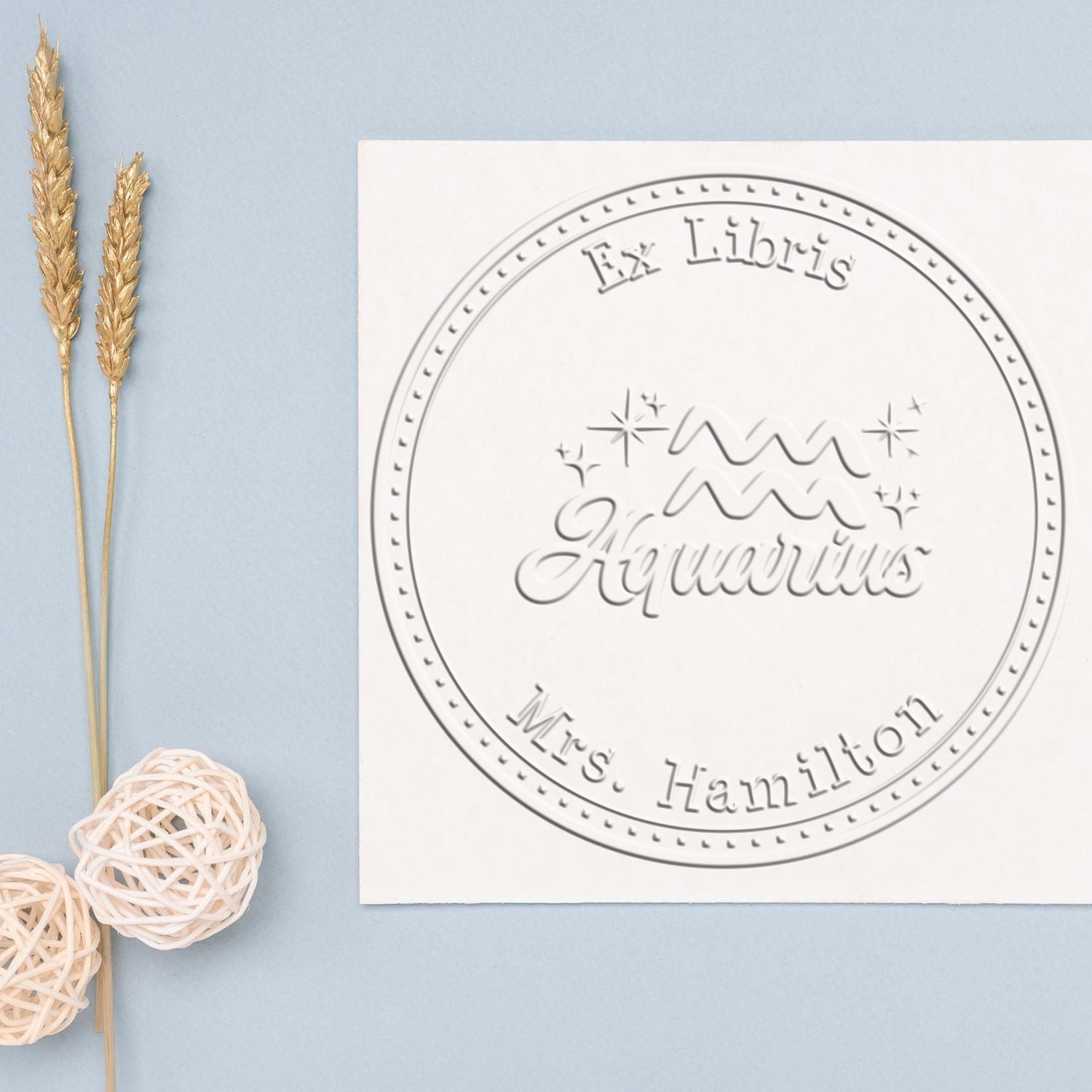 Soft Aquarius Zodiac Symbol with Scripted Font Personalized Bibliophile Paper Embosser