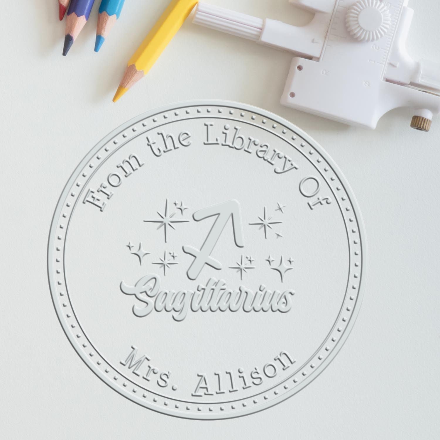 Soft Sagittarius Zodiac Symbol with Scripted Font Personalized Book Belongs to Embossed Stamp
