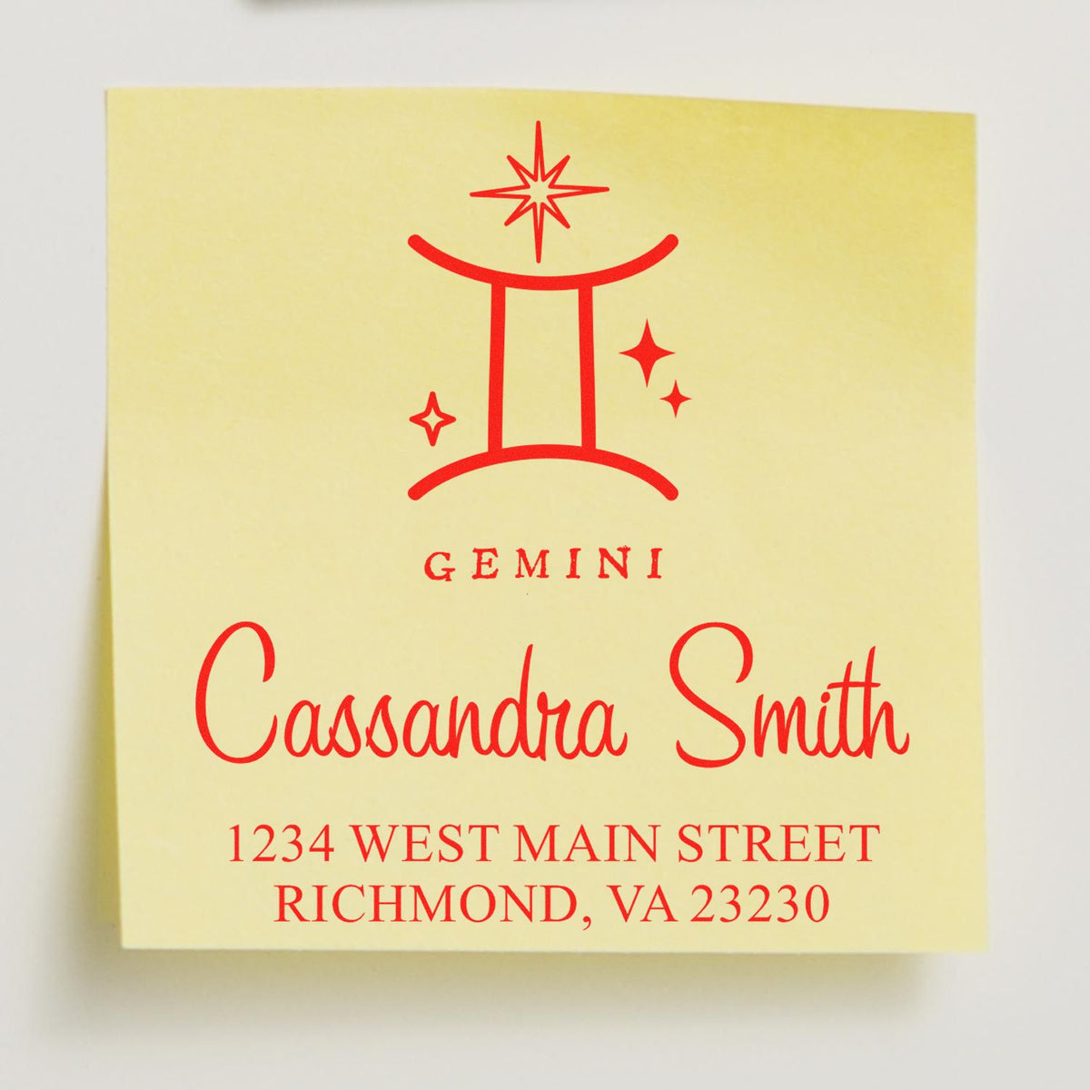 Red Gemini stamp and seal design on pale yellow background with Cassandra Smith name and Richmond, VA address.
