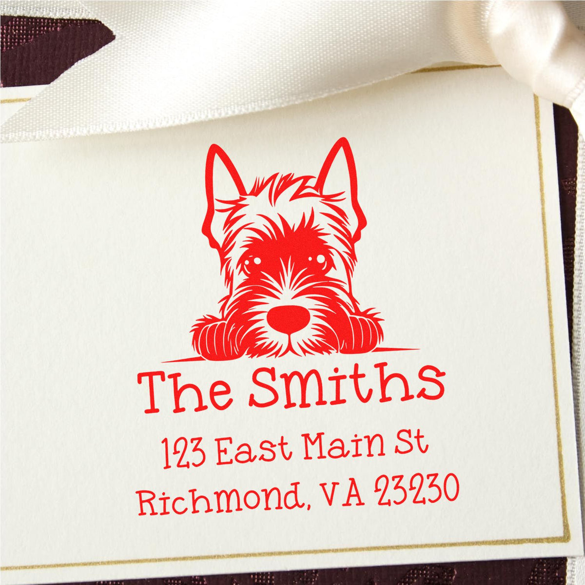 Red custom address stamp and seal with Scottie dog, The Smiths, on cream card with gold border and white ribbon.