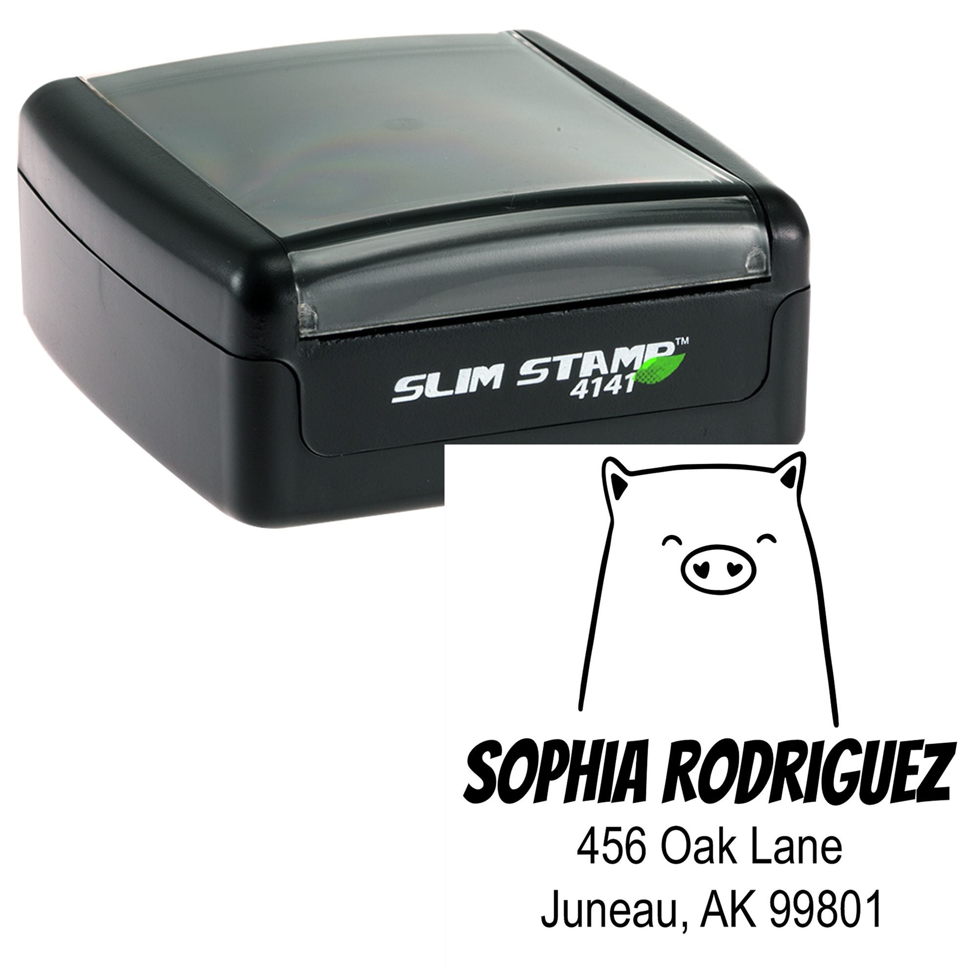 Image of a Portable Pre-Inked Cheery Pig Custom Designed Mailing Stamp. The Custom Return Mail Stamper features a smiling pig illustration with the name "Sophia Rodriguez" and address "456 Oak Lane, Juneau, AK 99801" below it.