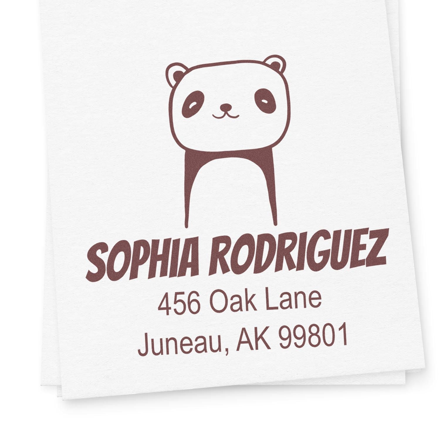 Playful Panda Pre-Inked Customized Name And Address Stamper featuring a cute panda design. The Custom Return Mail Stamp displays "Sophia Rodriguez, 456 Oak Lane, Juneau, AK 99801" in bold, playful font on white paper.